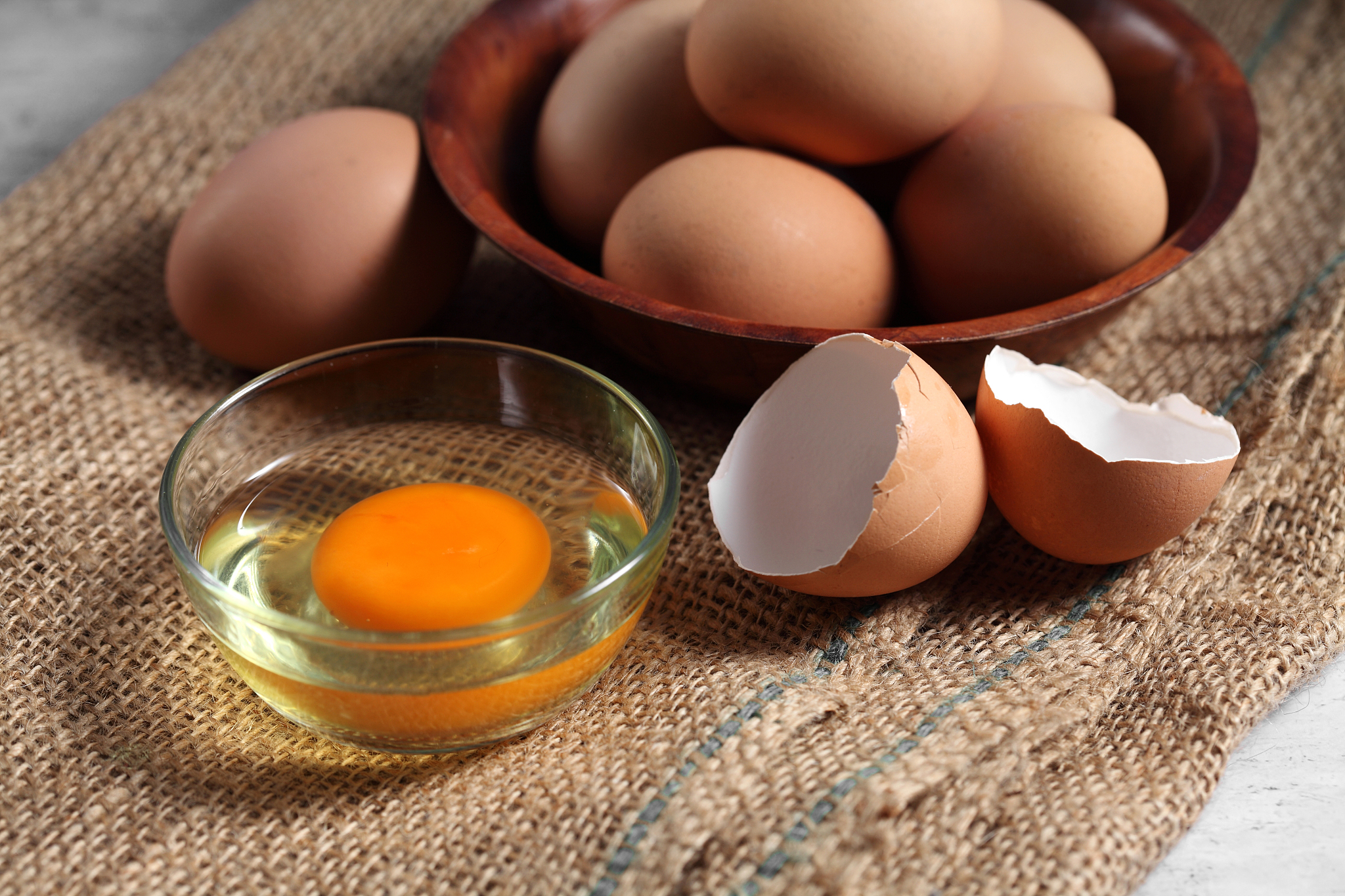 group of of raw chicken eggs on rustic background, organic eggs 