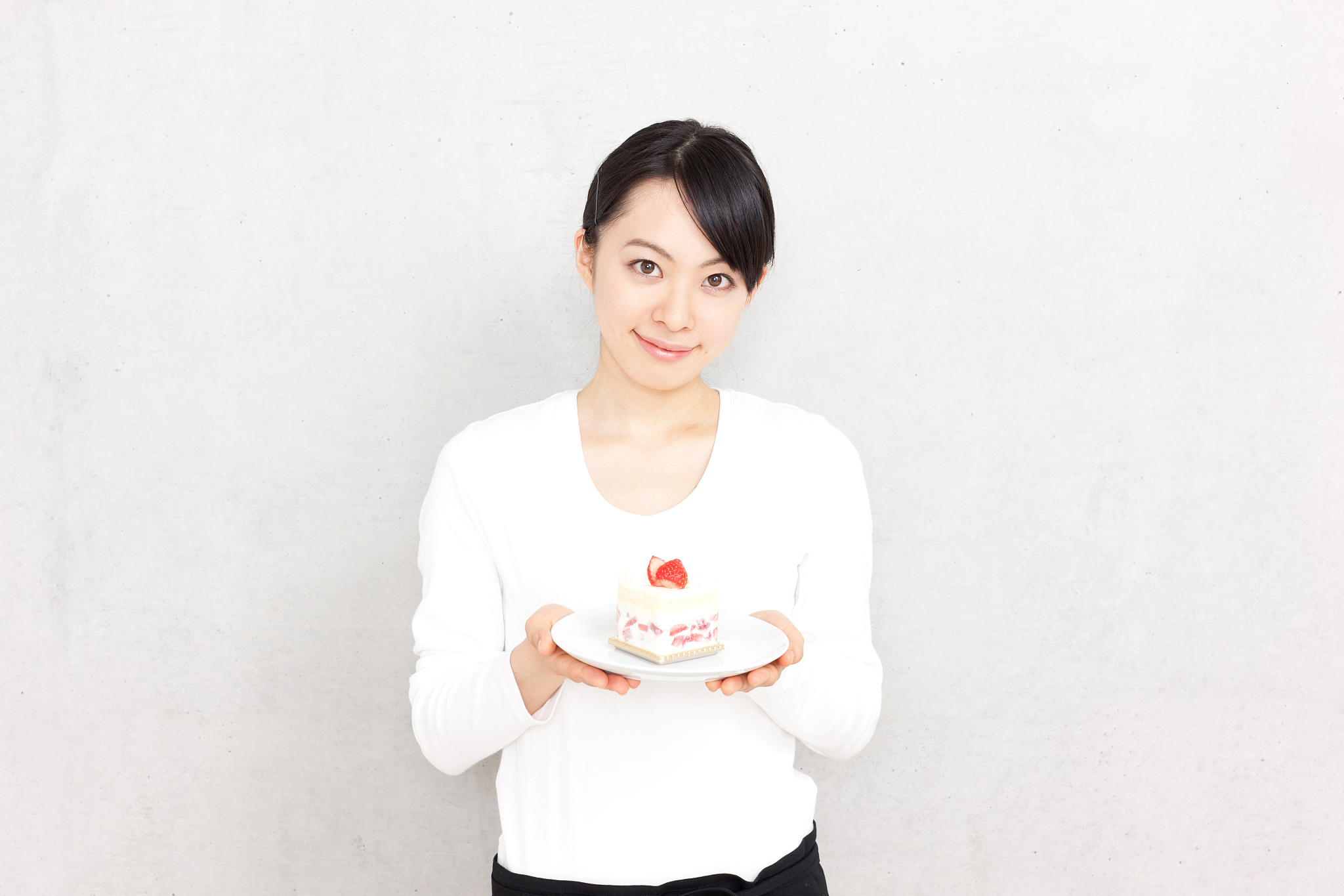 japanese woman holding a shortcake