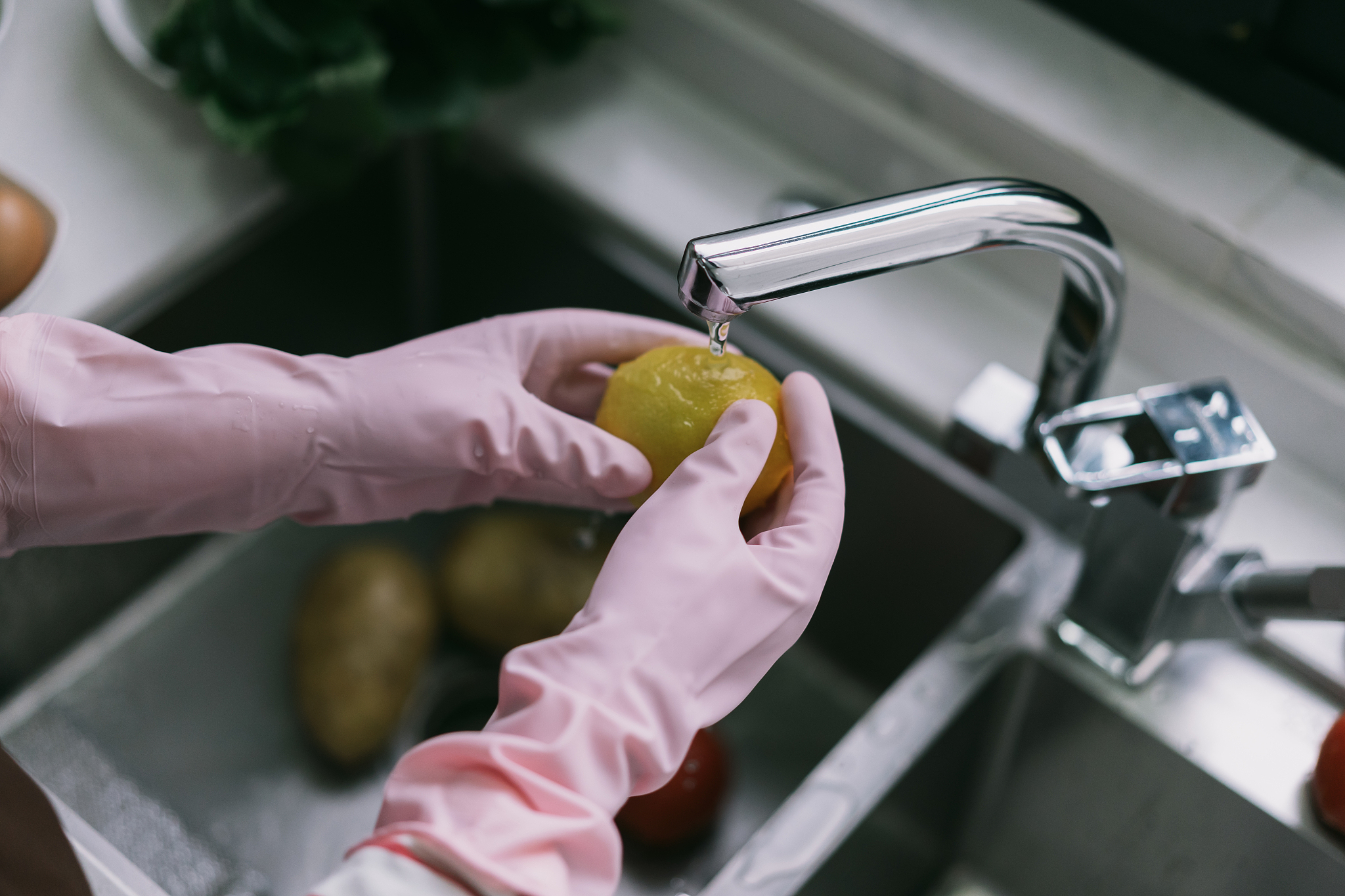 asia woman washing vegetable in kitchen