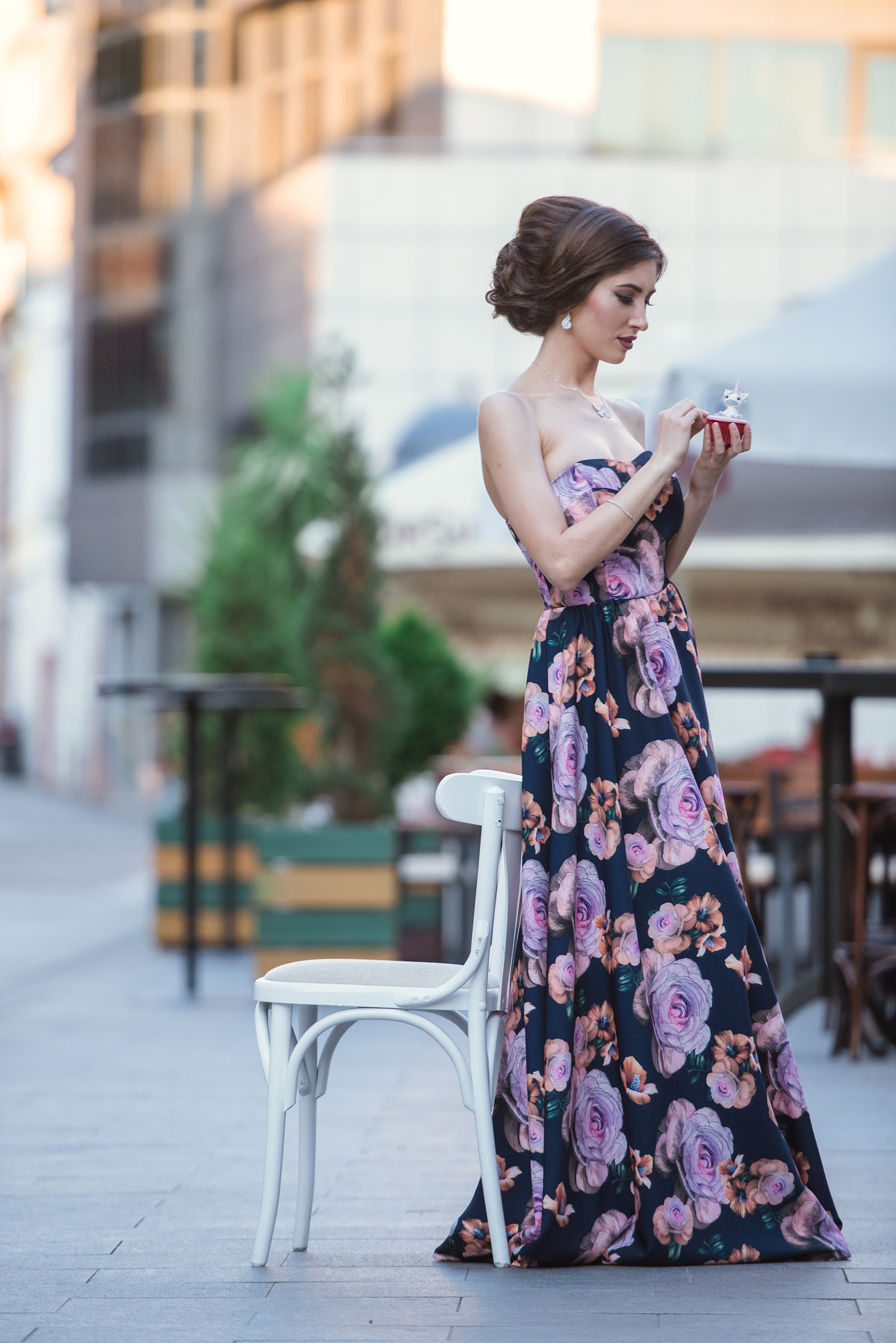 woman sitting on seat in city