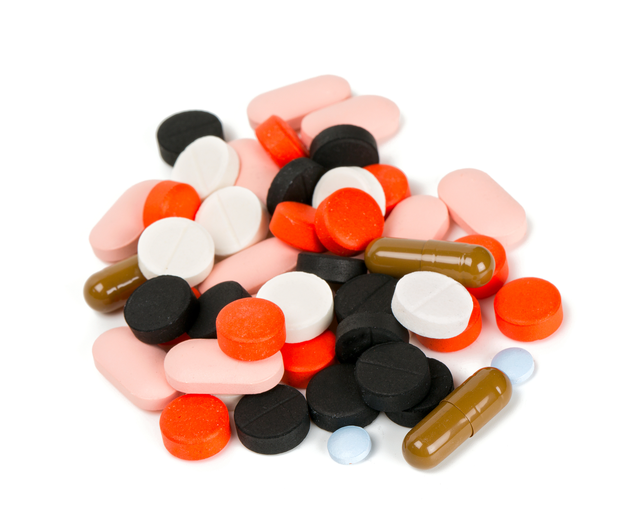 pile of different pills isolated on white