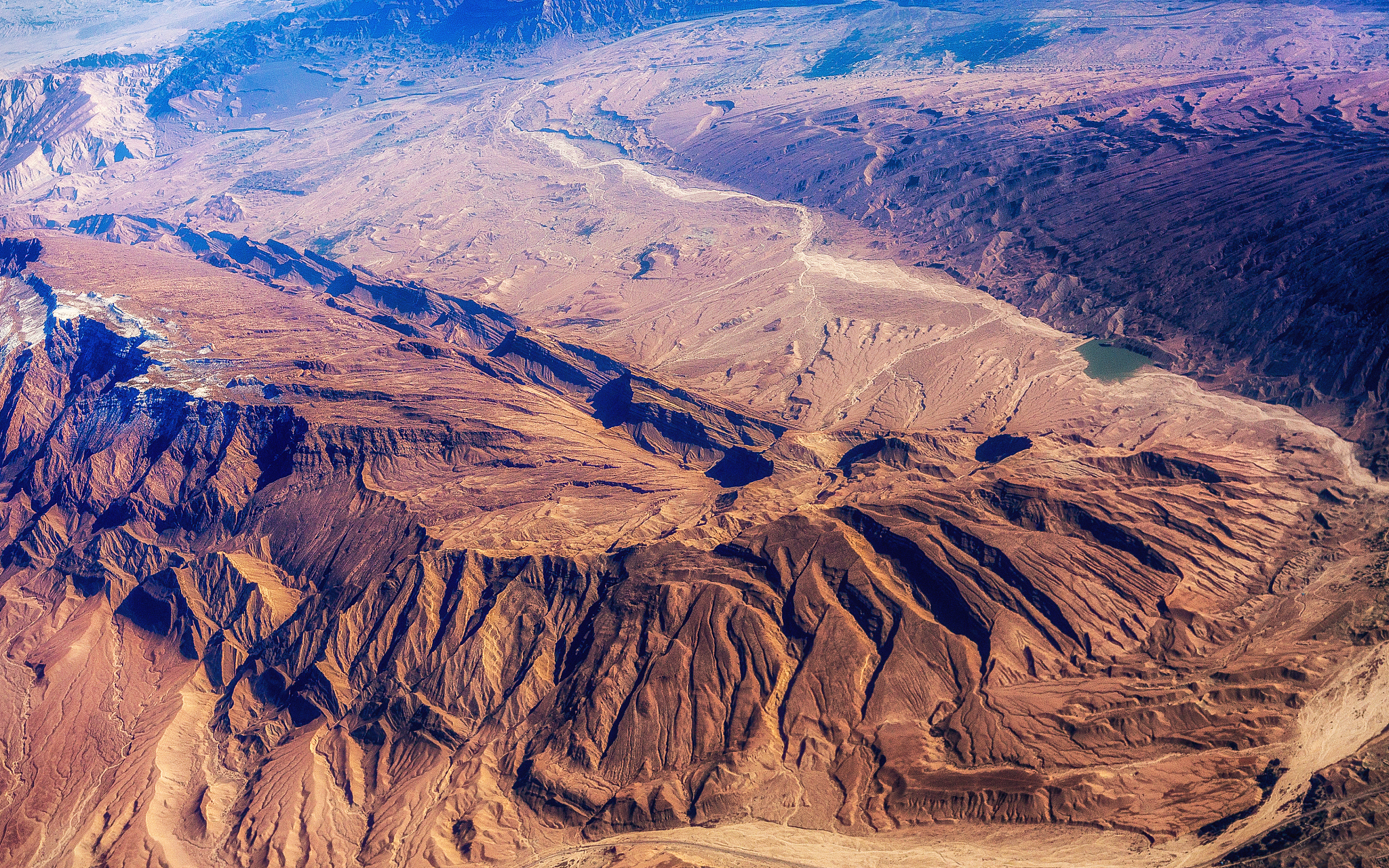 aerial view of airplane wing on the landscape