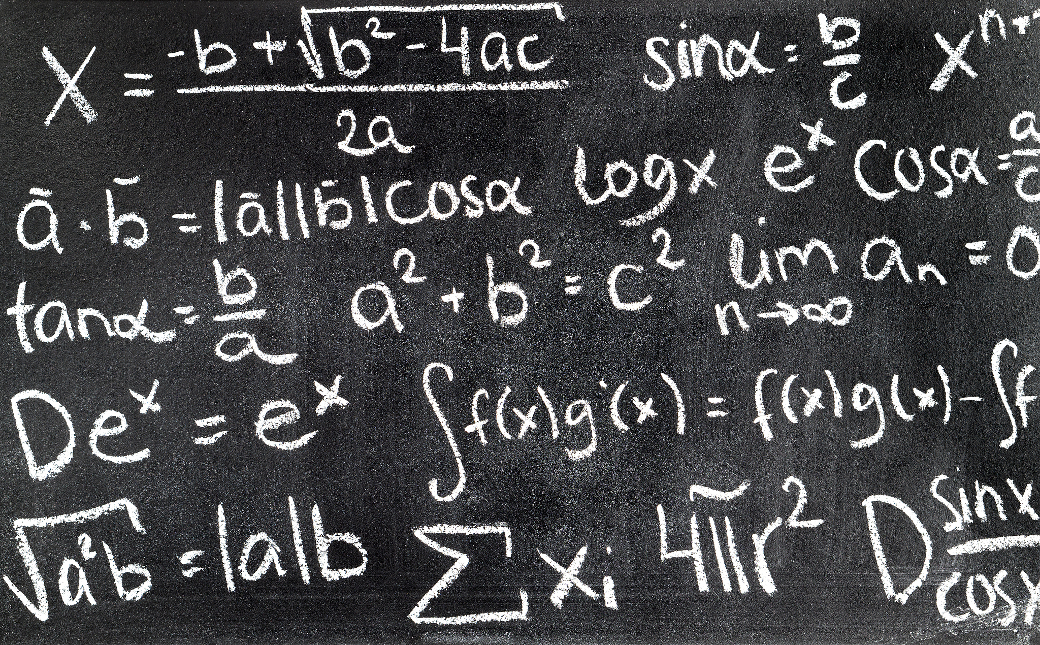 handwritten mathematical formulas on blackboard written with cha