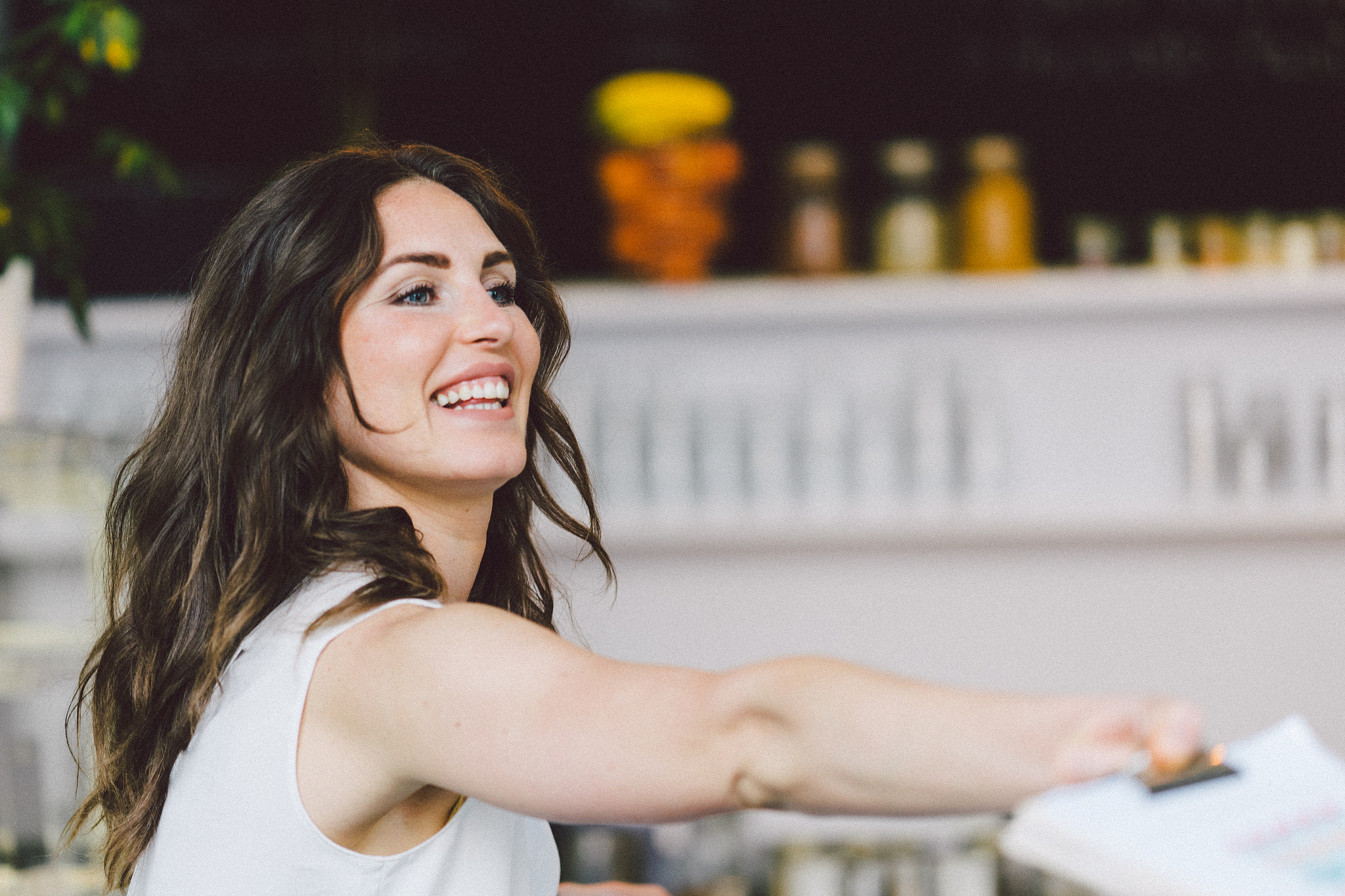 coffee shop owner show menu to clients