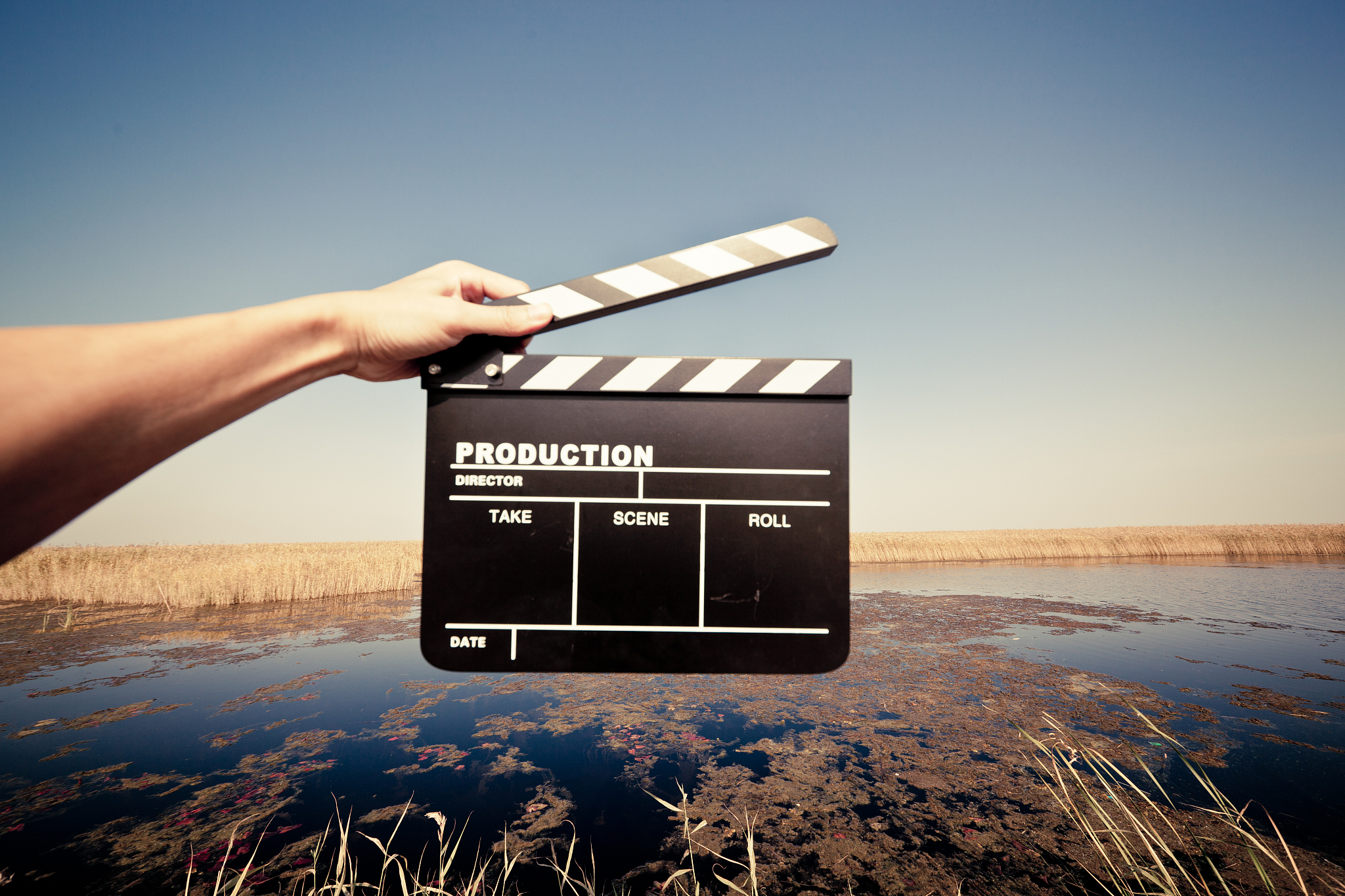hands holding a movie clapboard