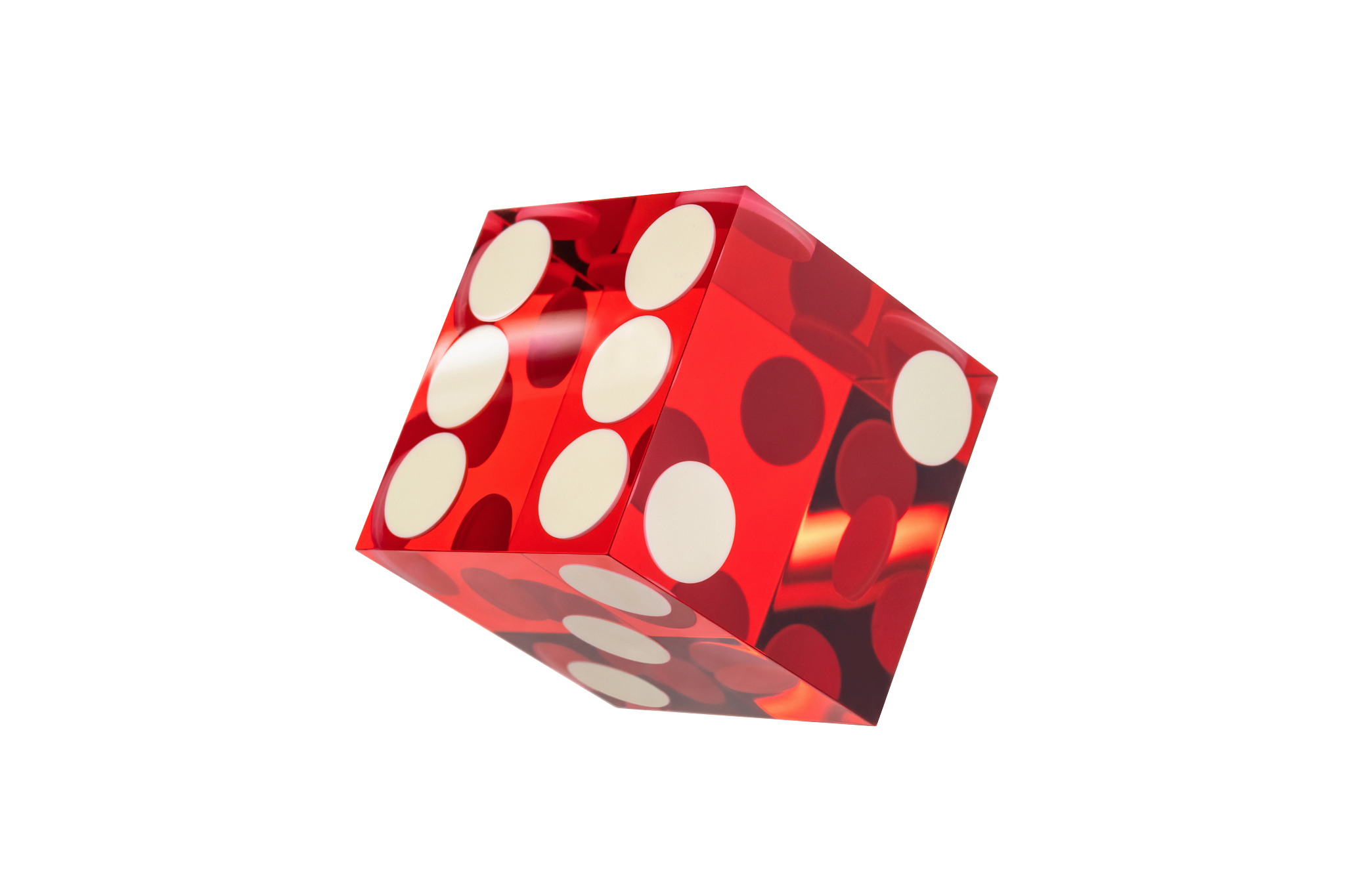 one dice red glass with sharp edges and a light flare, isolated 