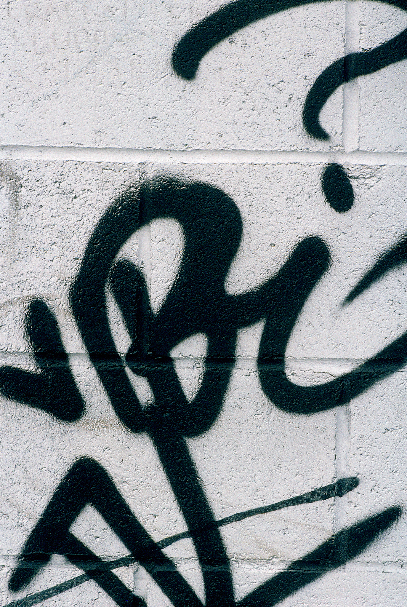 graffiti on cinder block wall