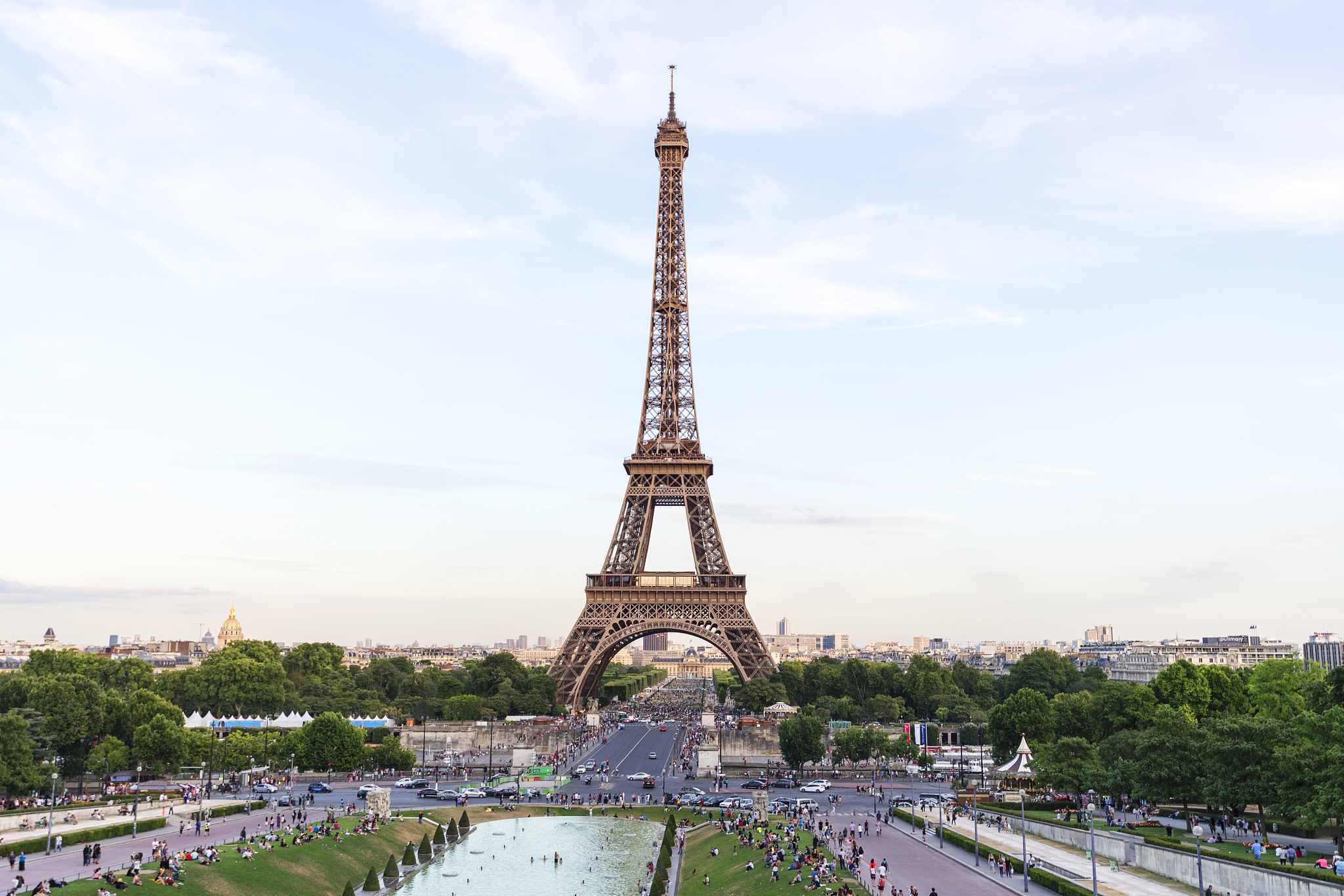 For over 130 years the Eiffel Tower locally named ______________ has been a powerful and distinctive symbol of the city of Paris