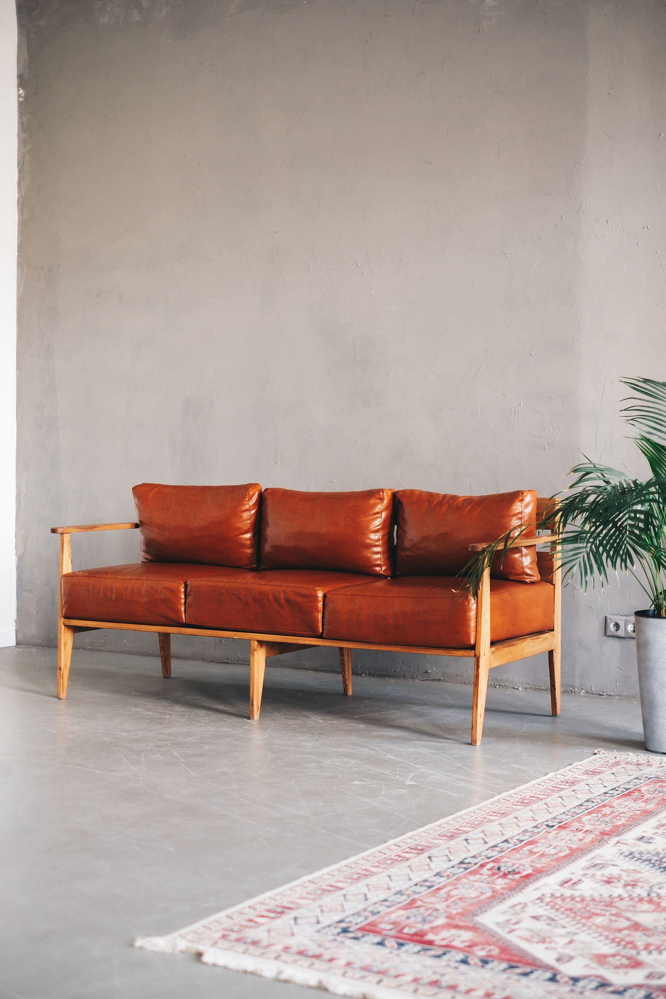 interior design of modern living room with brown leather sofa an