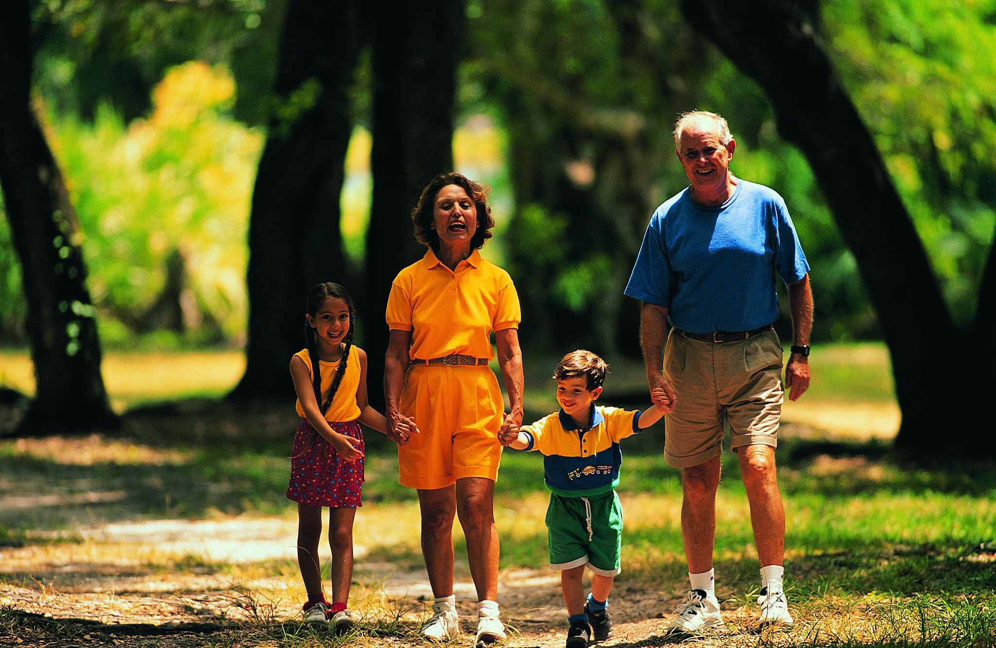 hispanic senior couple with grandchildren