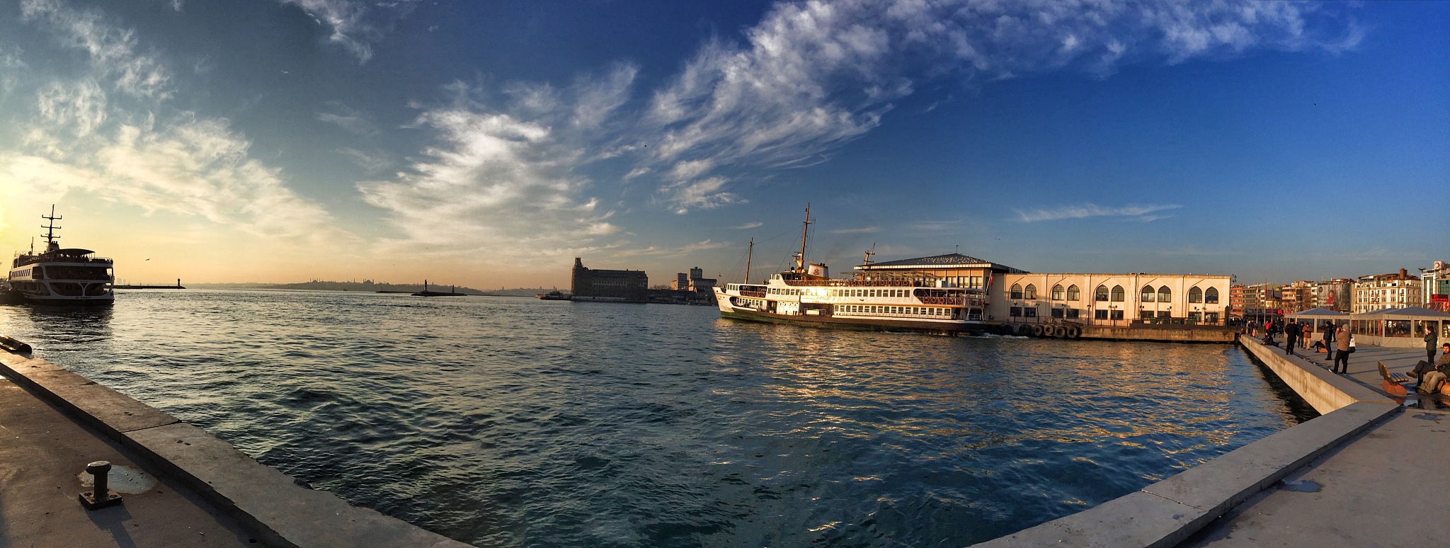 ships in sea against sky during sunset