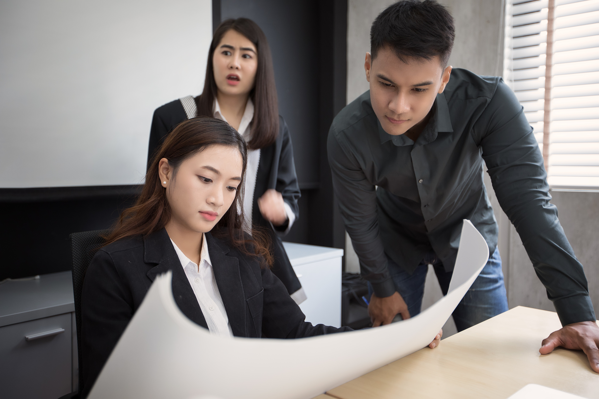 asian women and men engineers discussing business project and sm