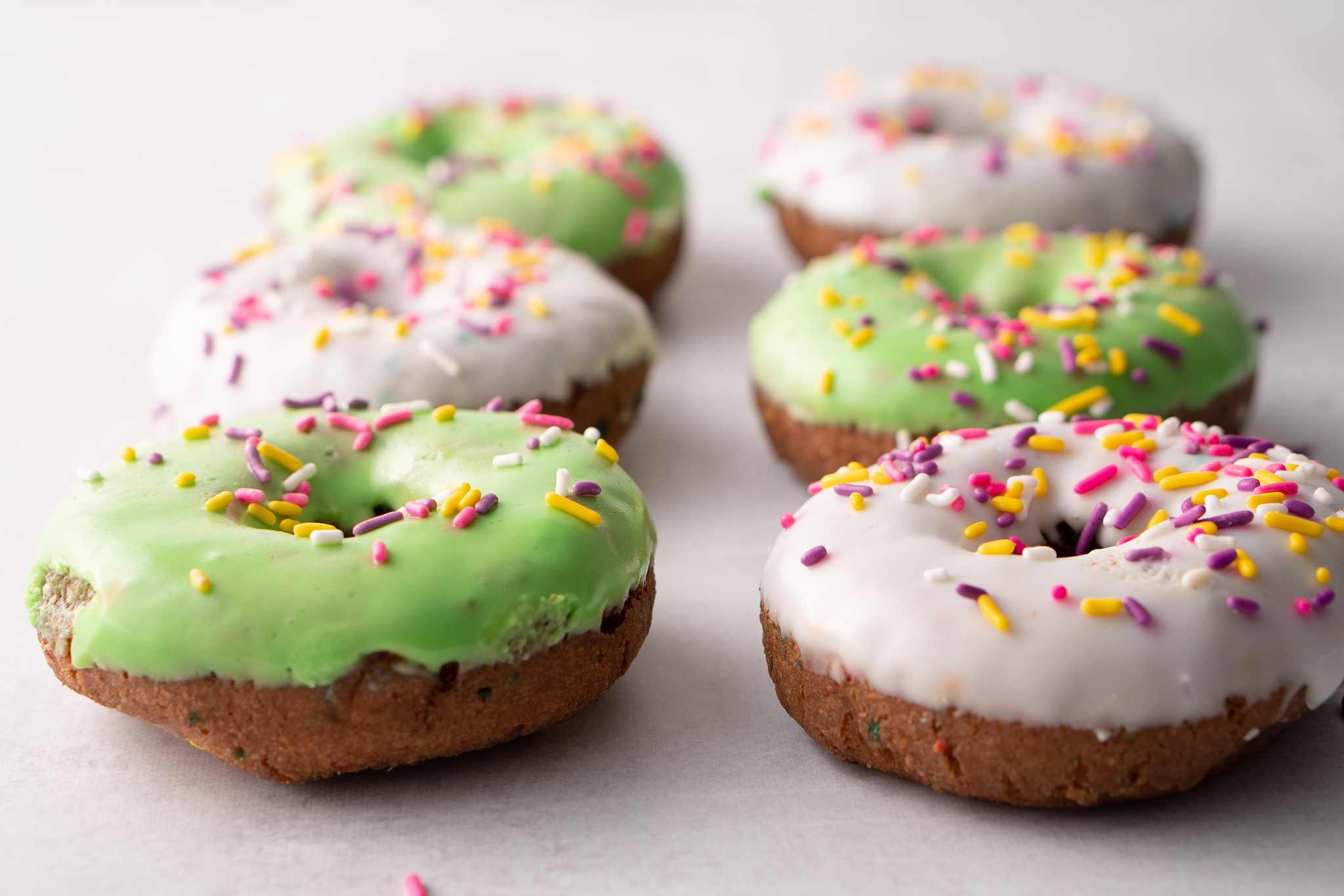 white and green sprinkled delicious doughnuts