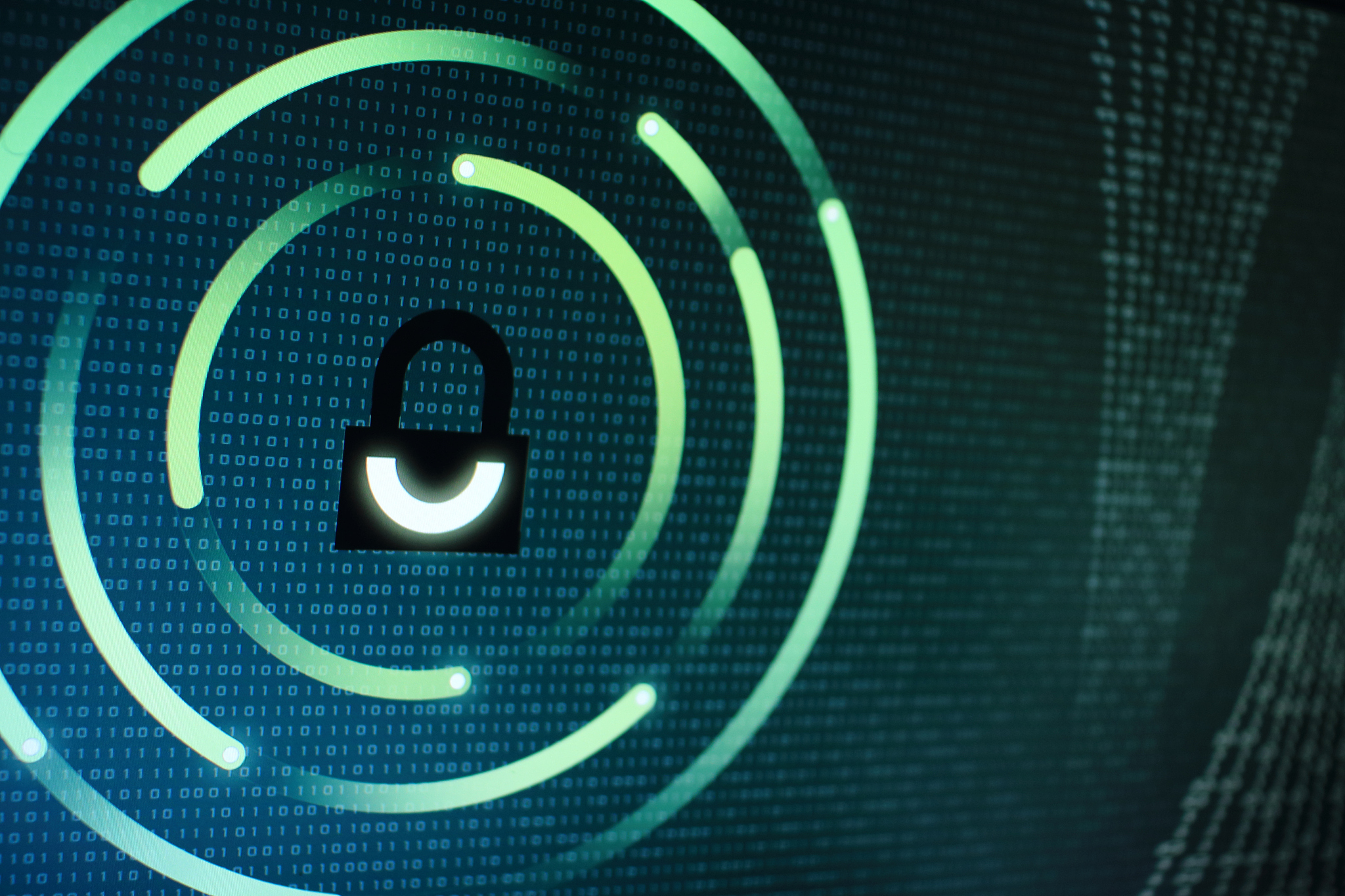 photo of computer screen display with black graphic lock symbol.