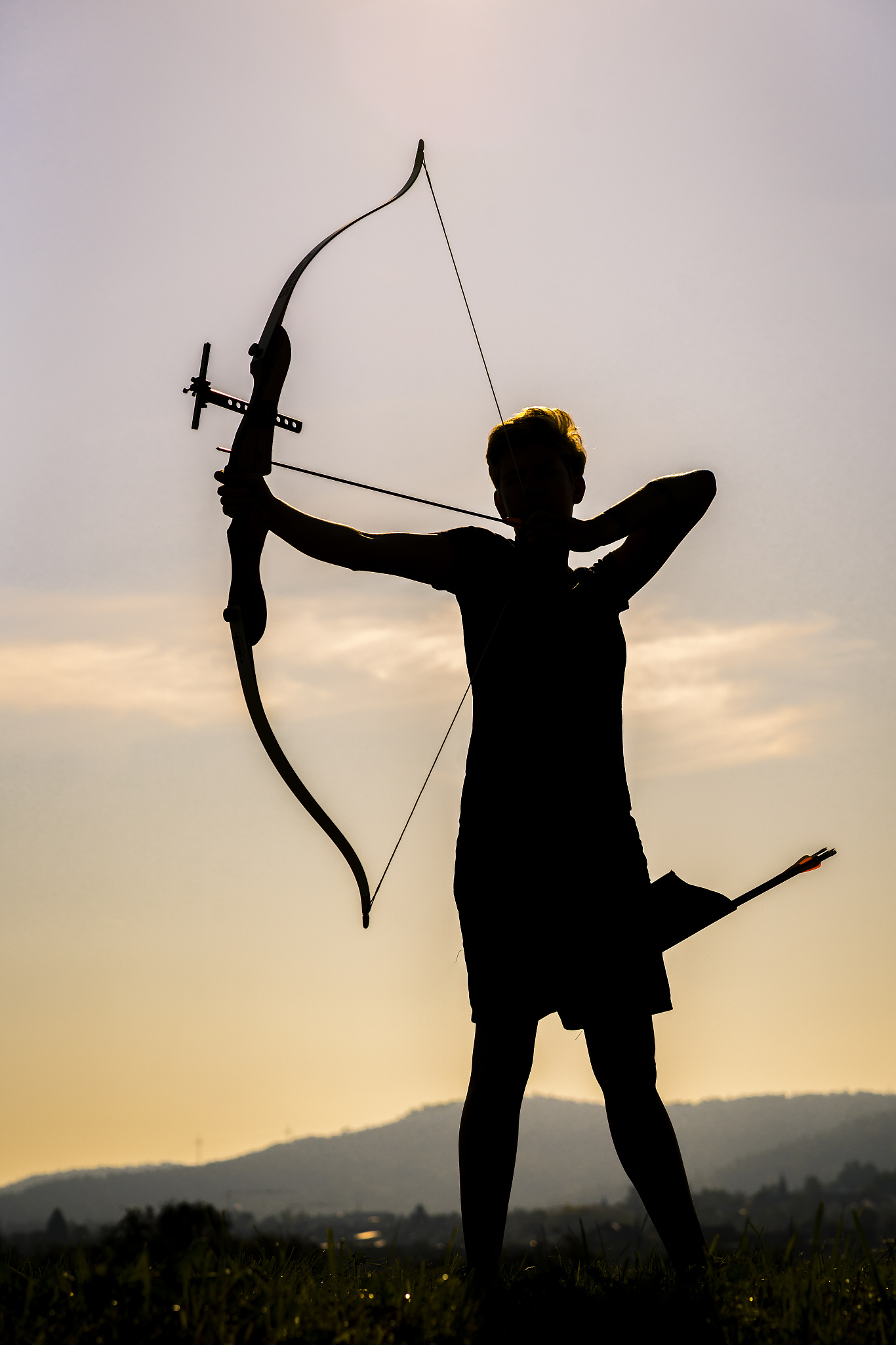 silhouette of an archeress at twilight