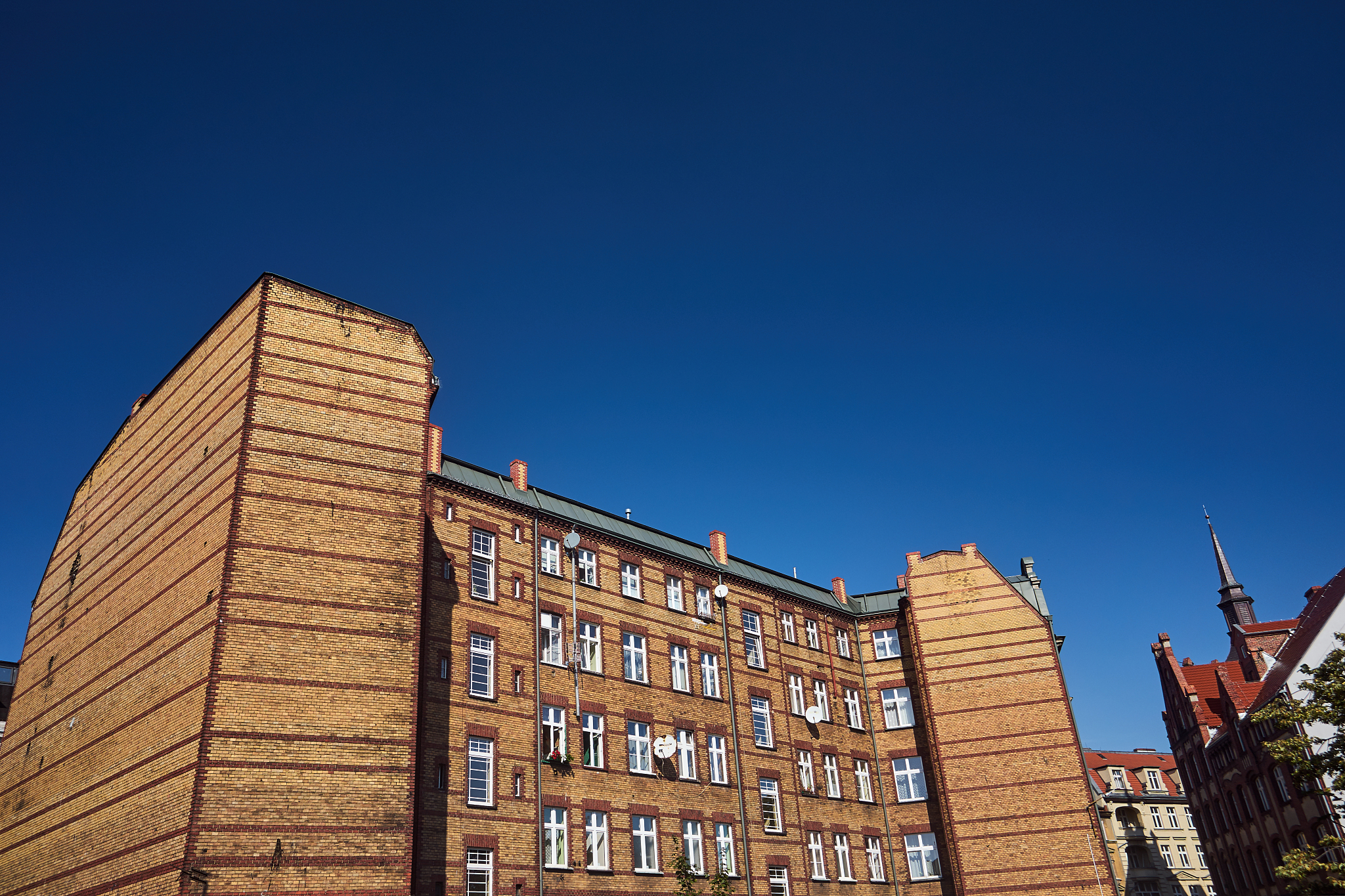 the brick wall of a residential building