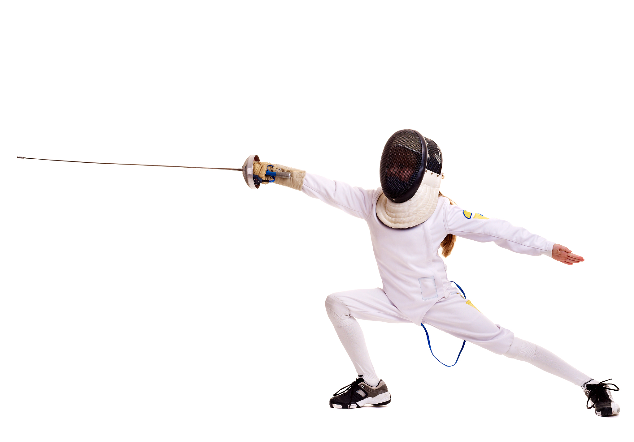 a child in full fencing gear lunging on white background
