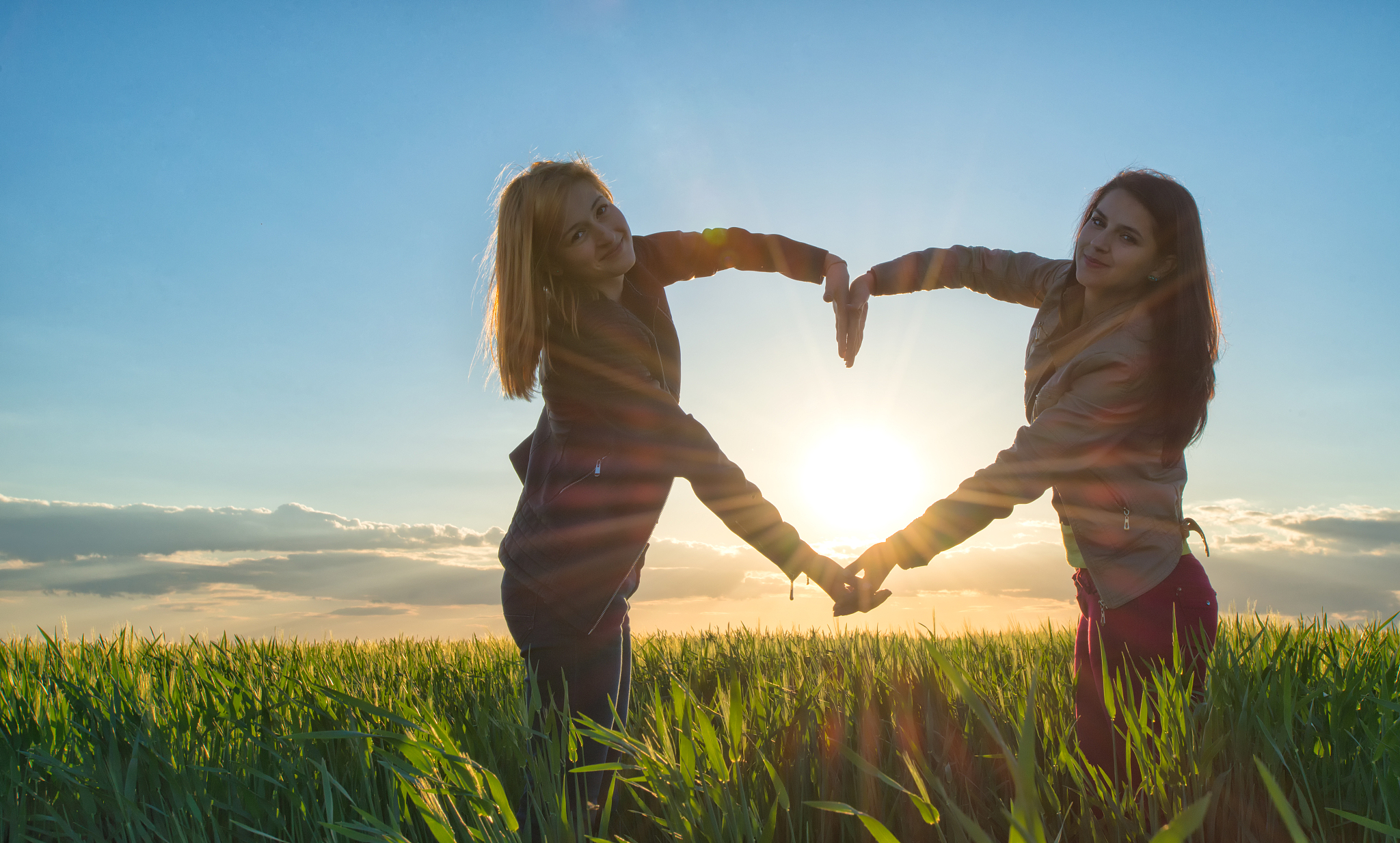 sunset heart made by  two girls