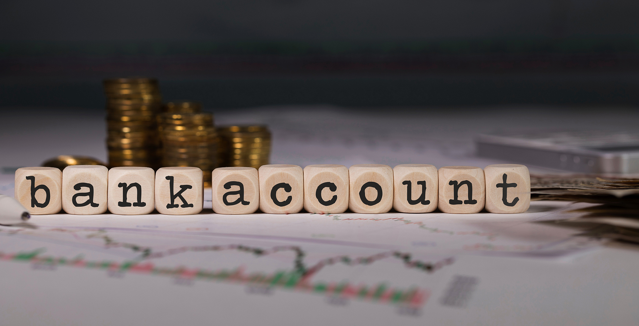 words bank account composed of wooden letters.