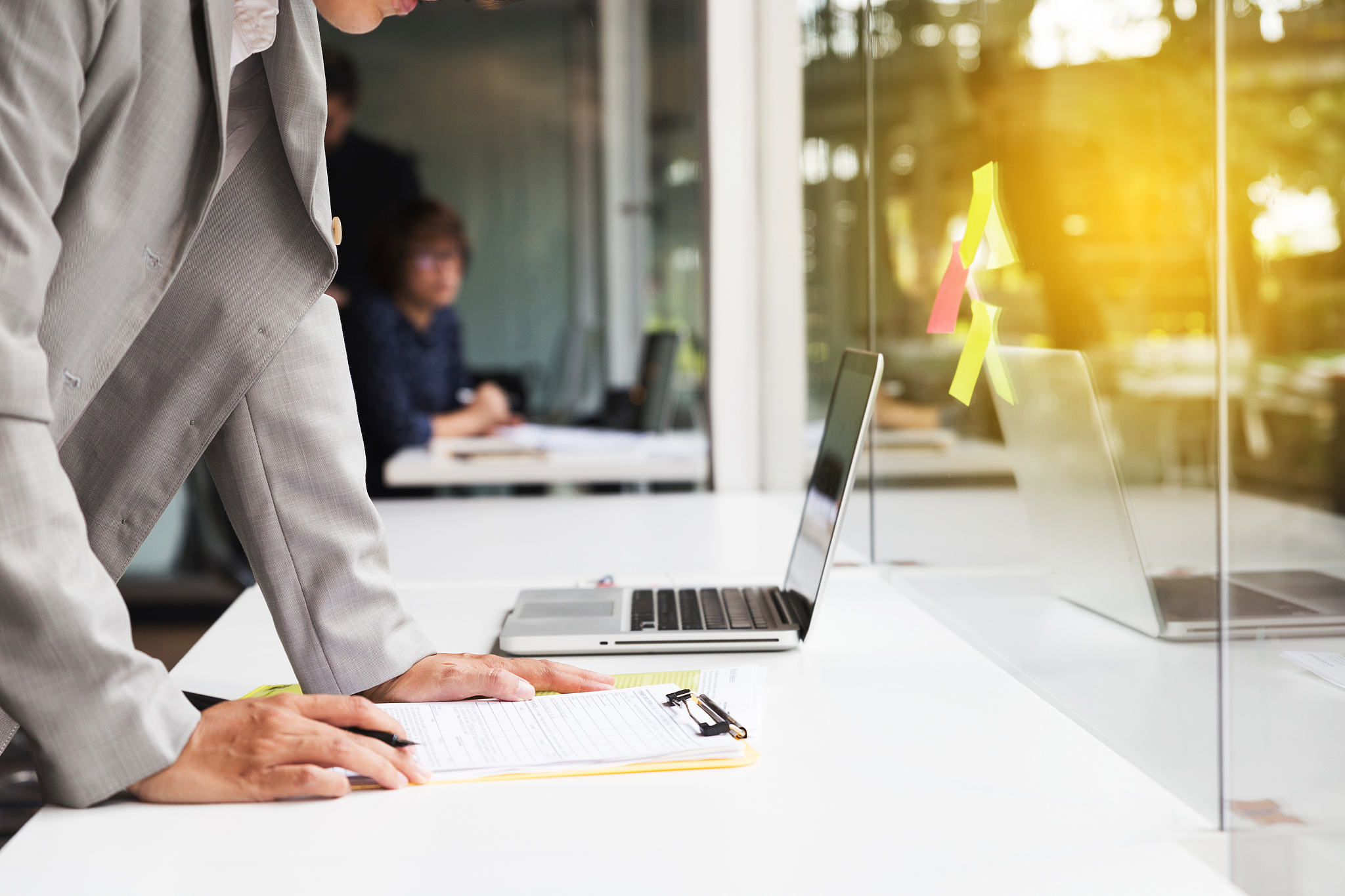 businesspeople working with document and computer in office work