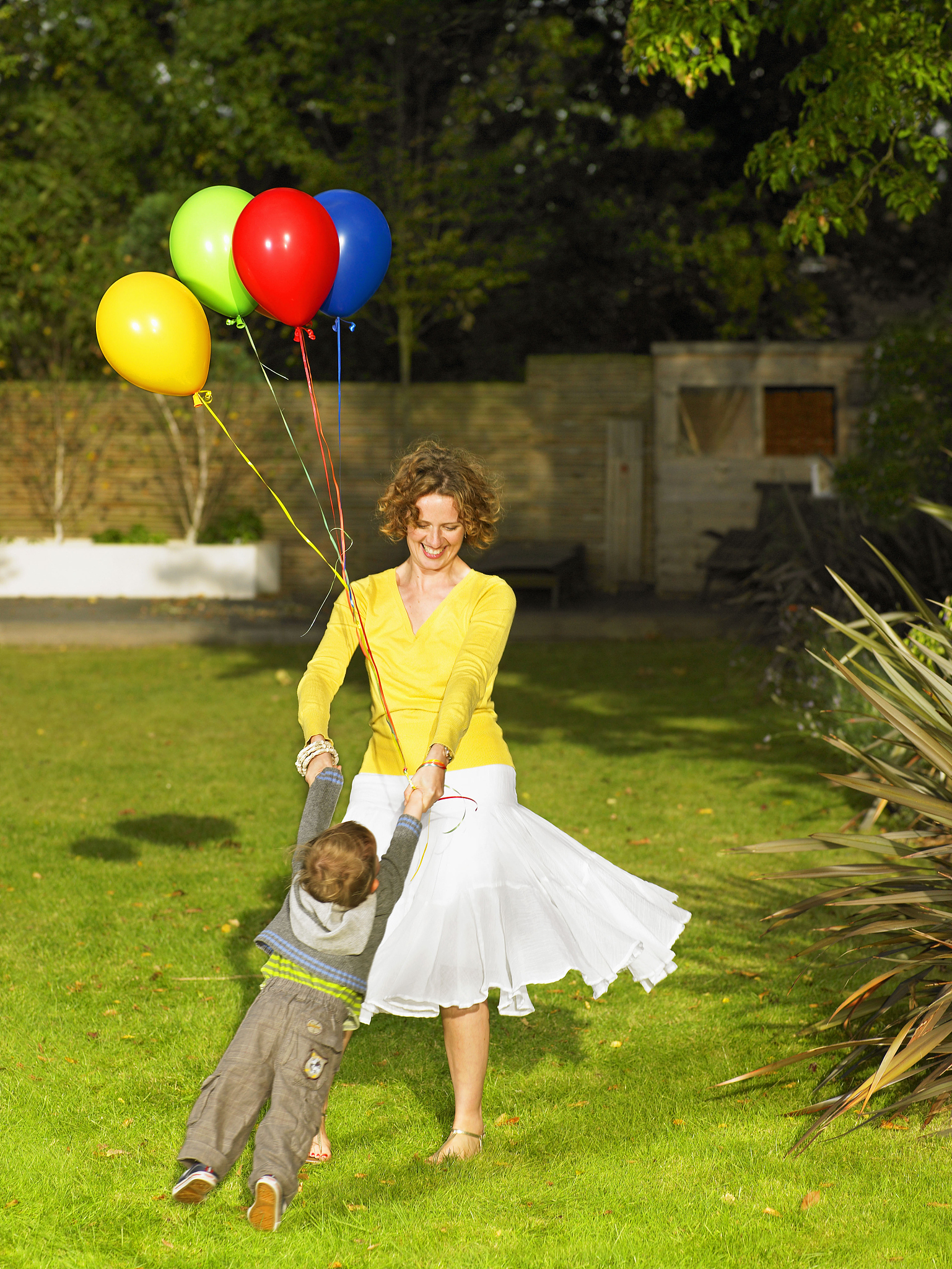mother and son playing in garden