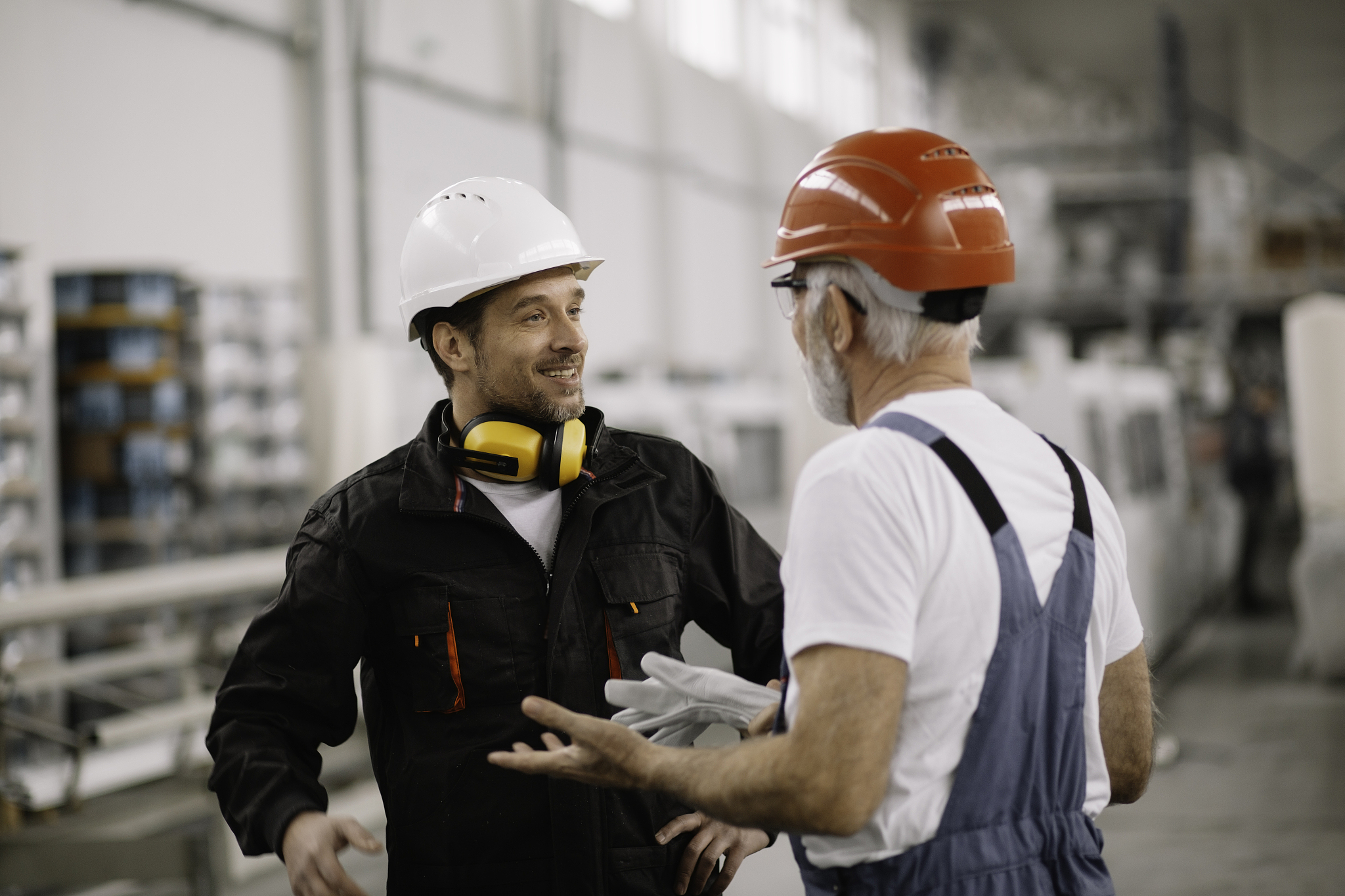colleagues working together. workers in factory.