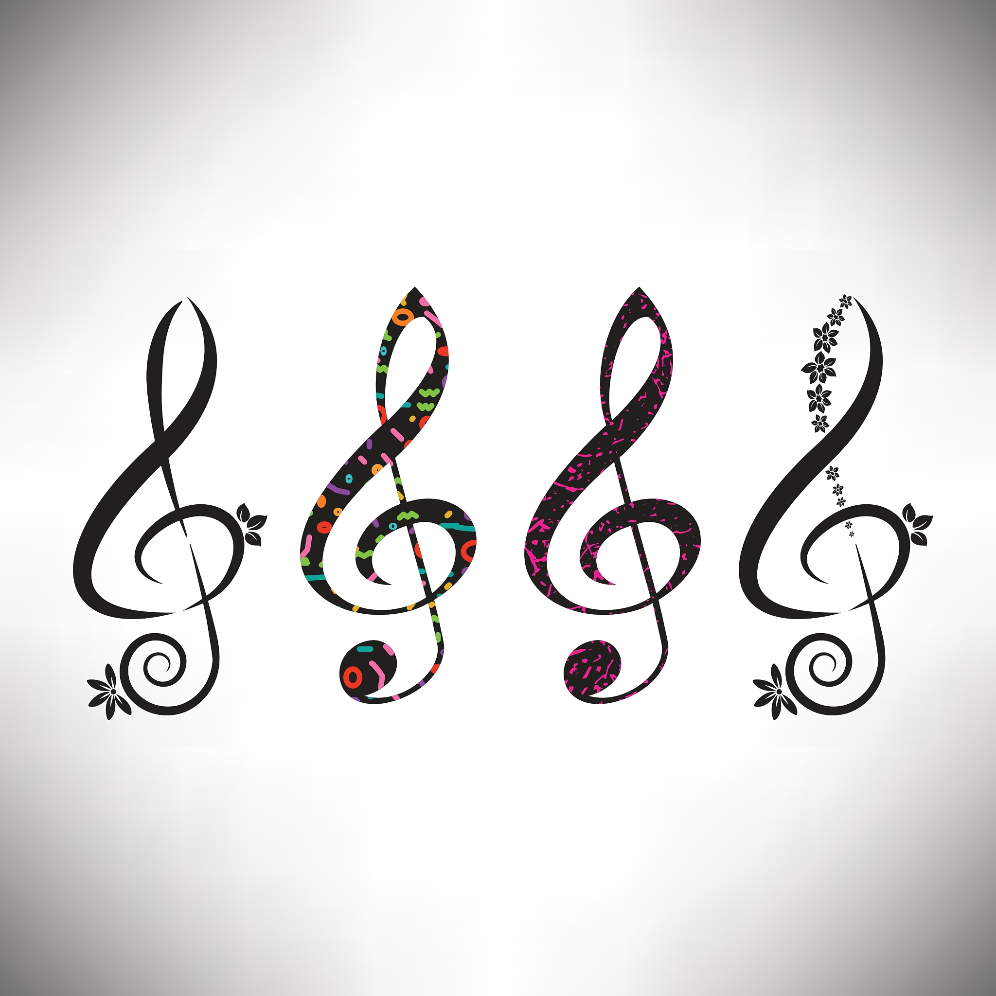 four assorted decorative g clefs