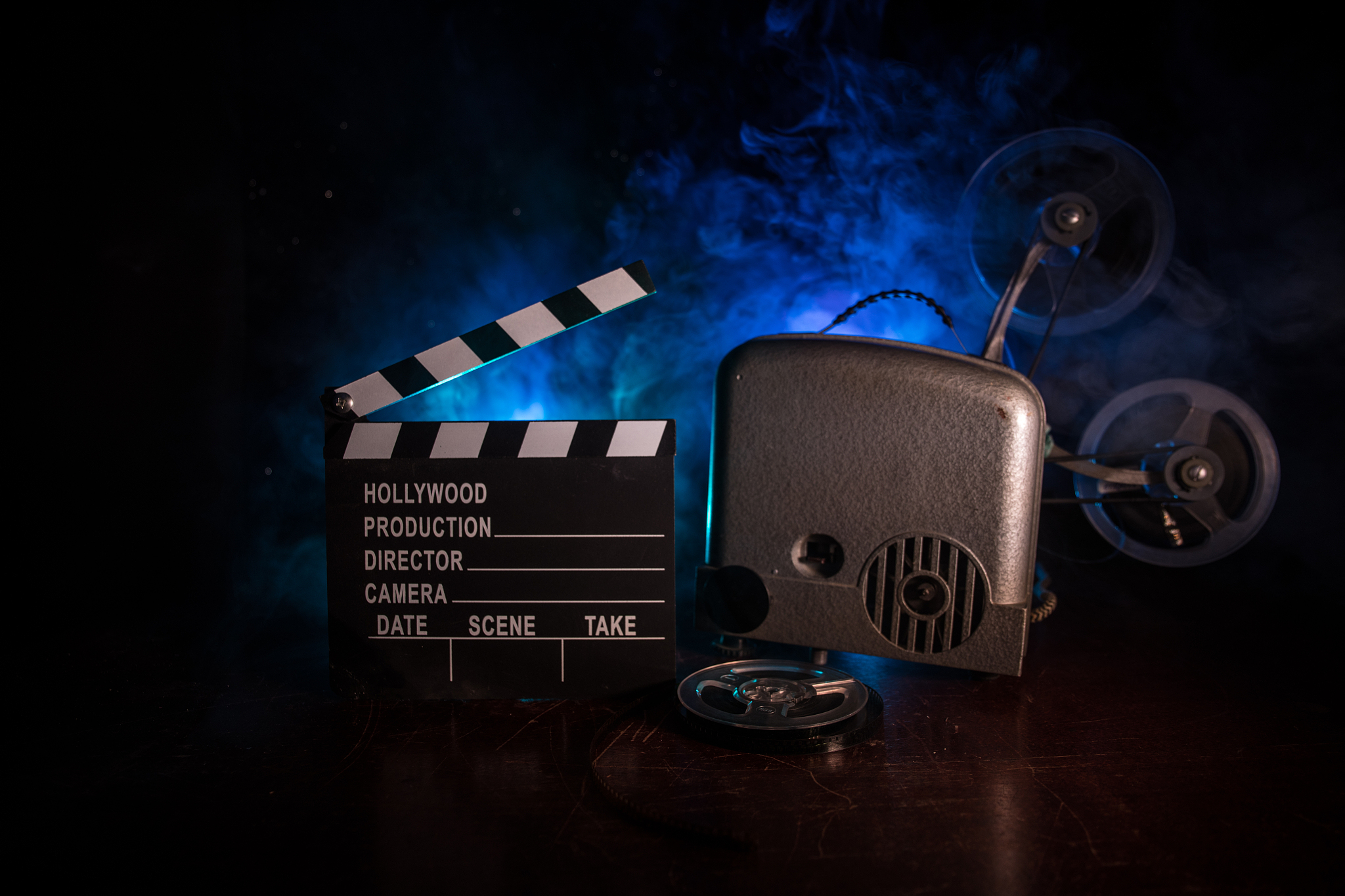 old vintage movie projector on a dark background with fog and li