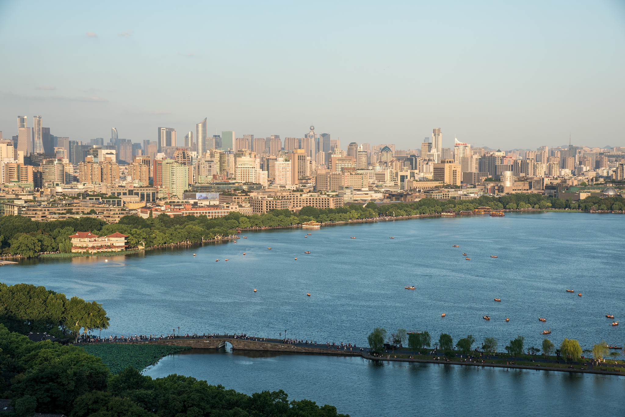 west lake with hangzhou skyline in summer on a sunny day, hangzh