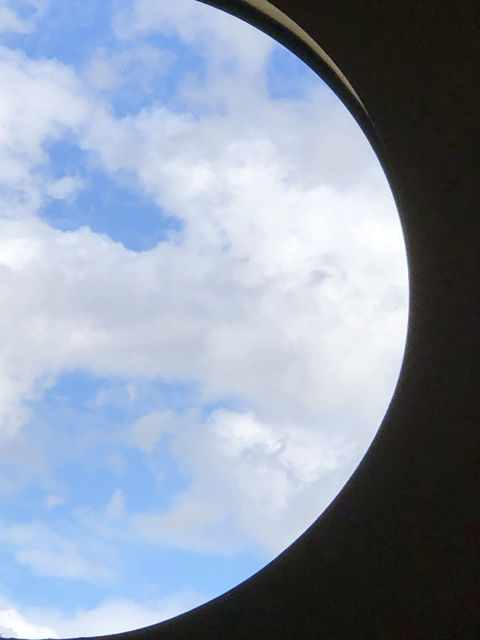 clouds thru round window