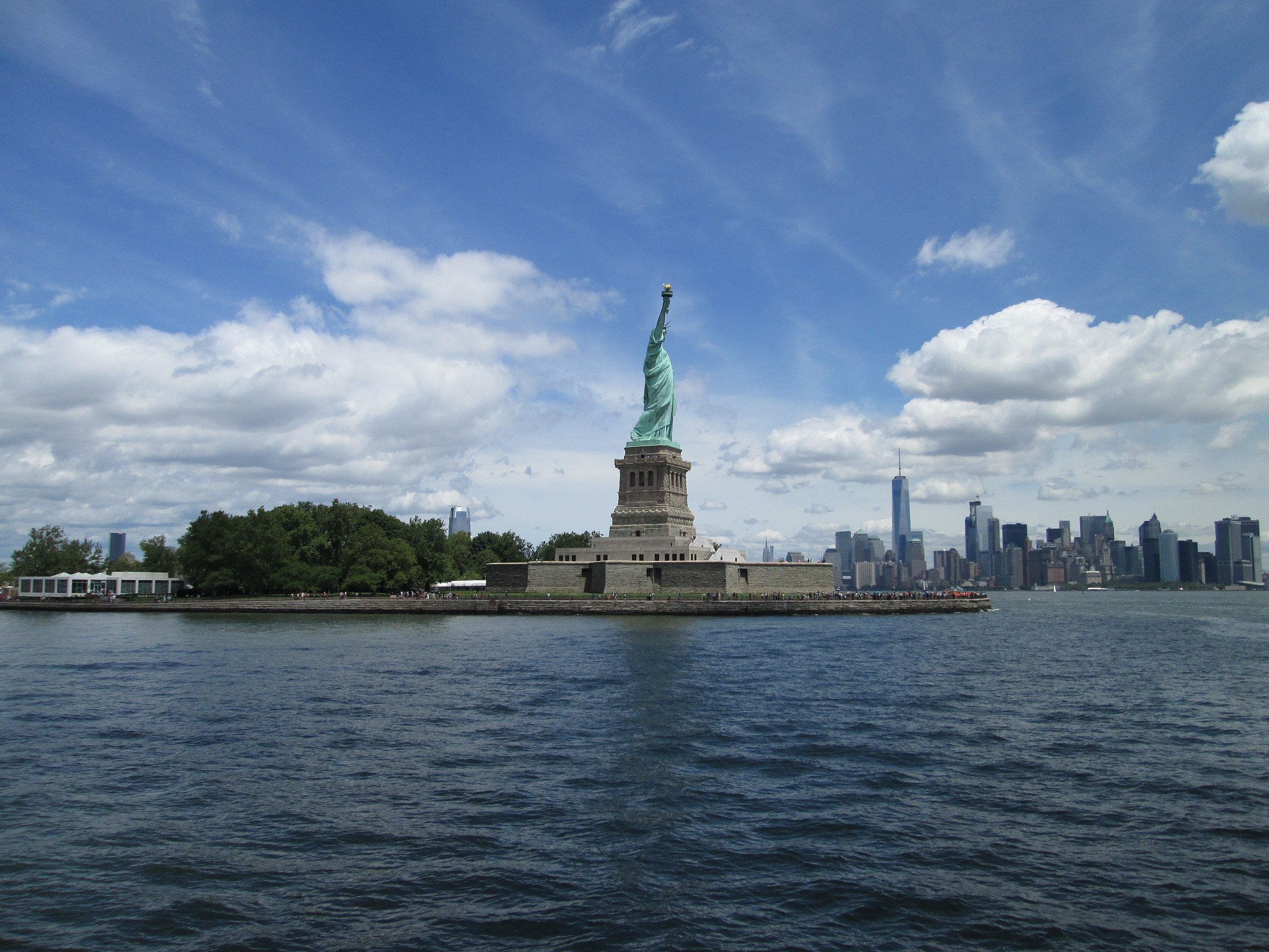 statue of liberty against cloudy sky