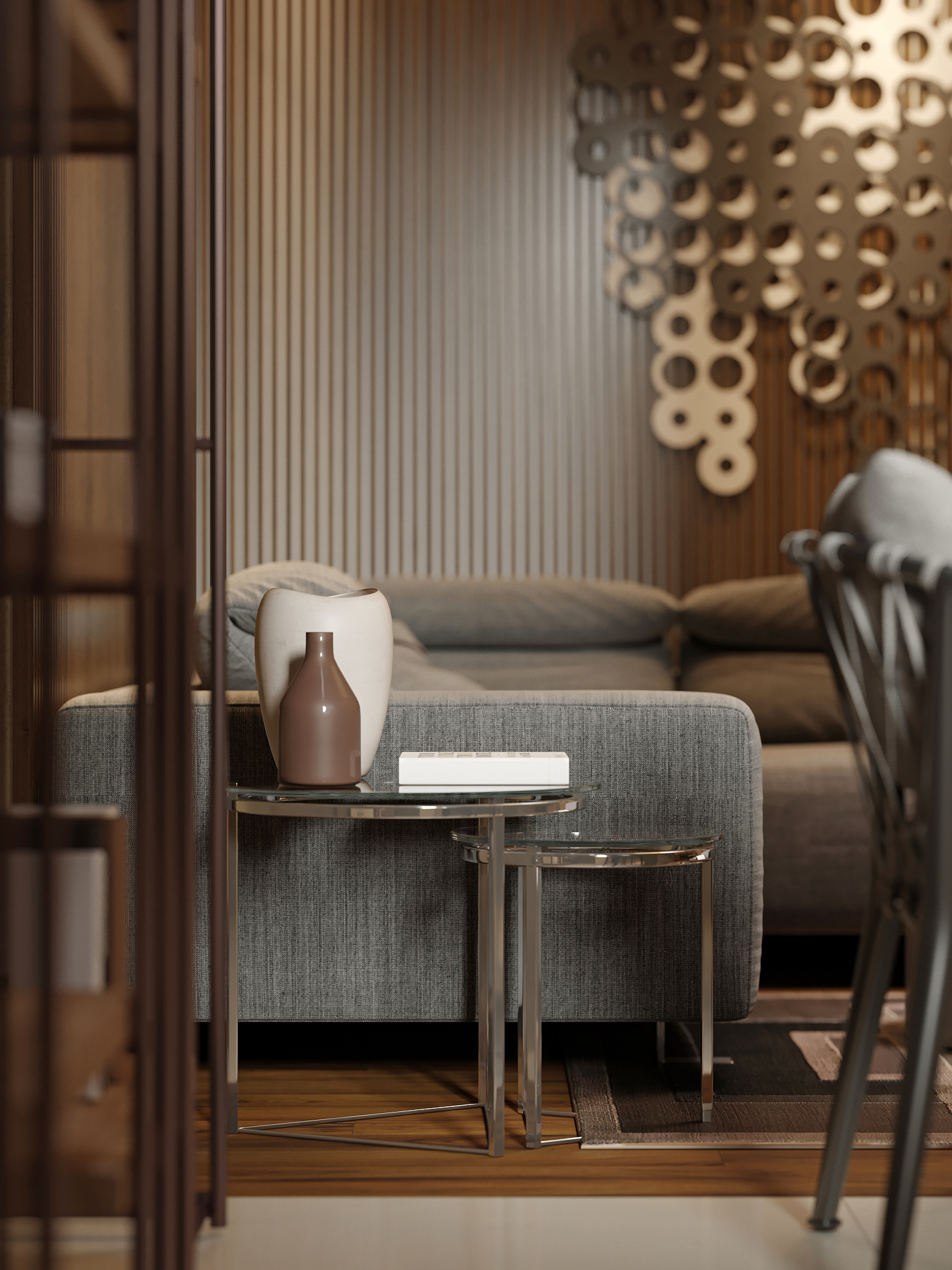 designer low metal side tables on a sofa with decor.