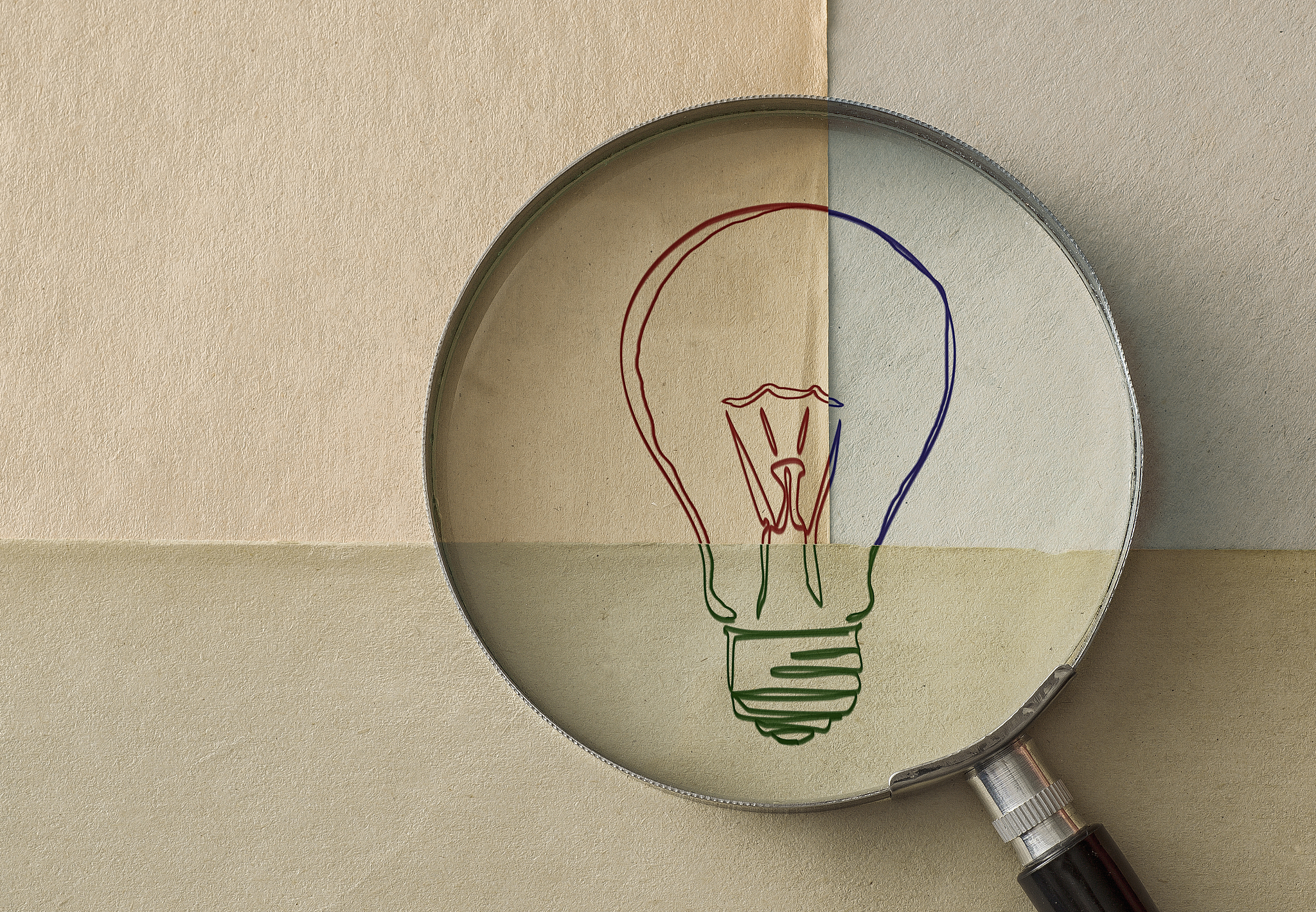 magnifying glass and light bulb