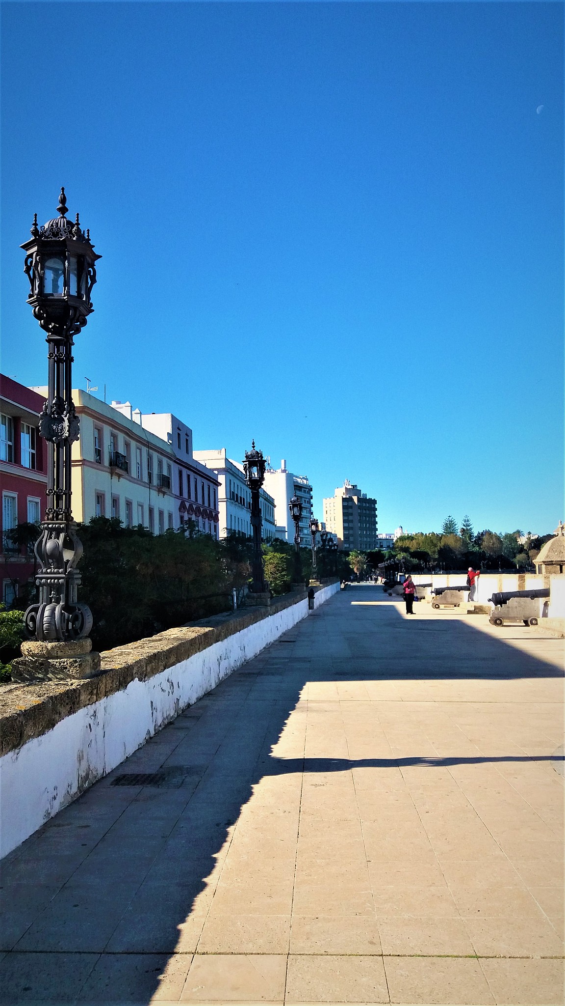 beautiful sunny promenade along cadiz coast in spain