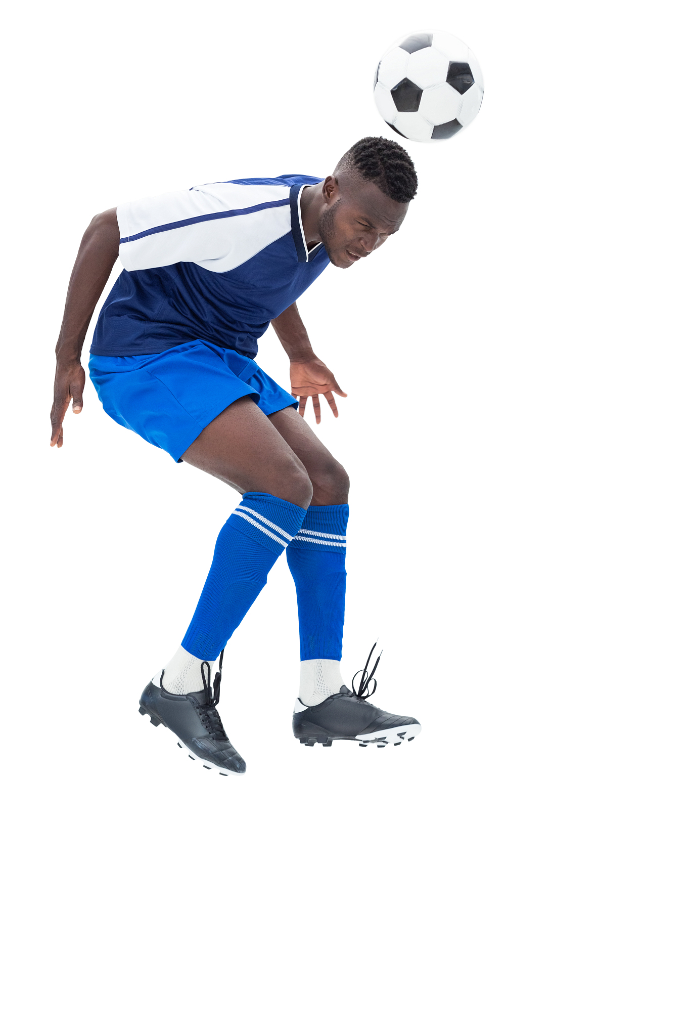 football player in blue heading ball