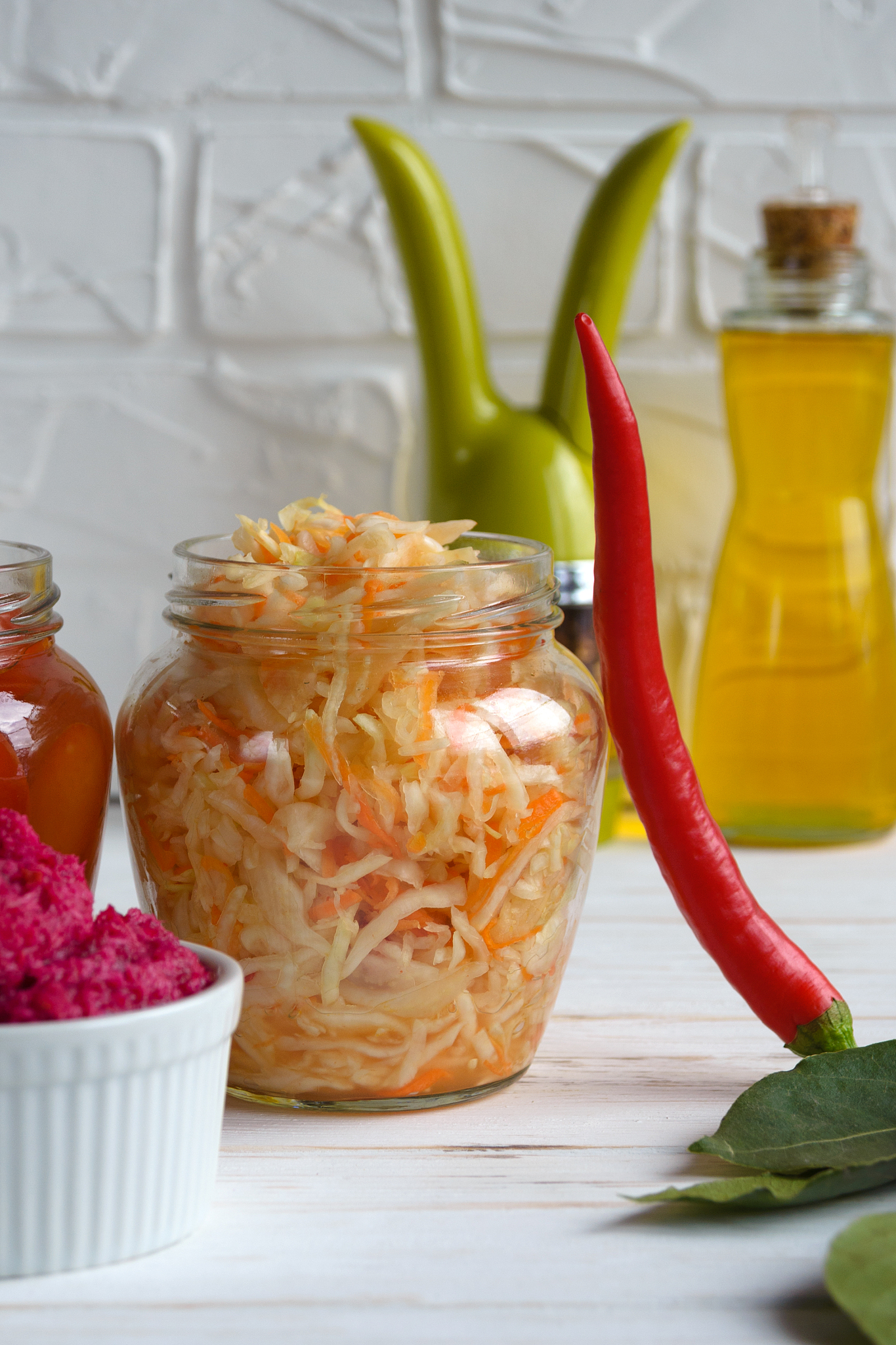 fermented foods. sauerkraut in a glass jar on a white background
