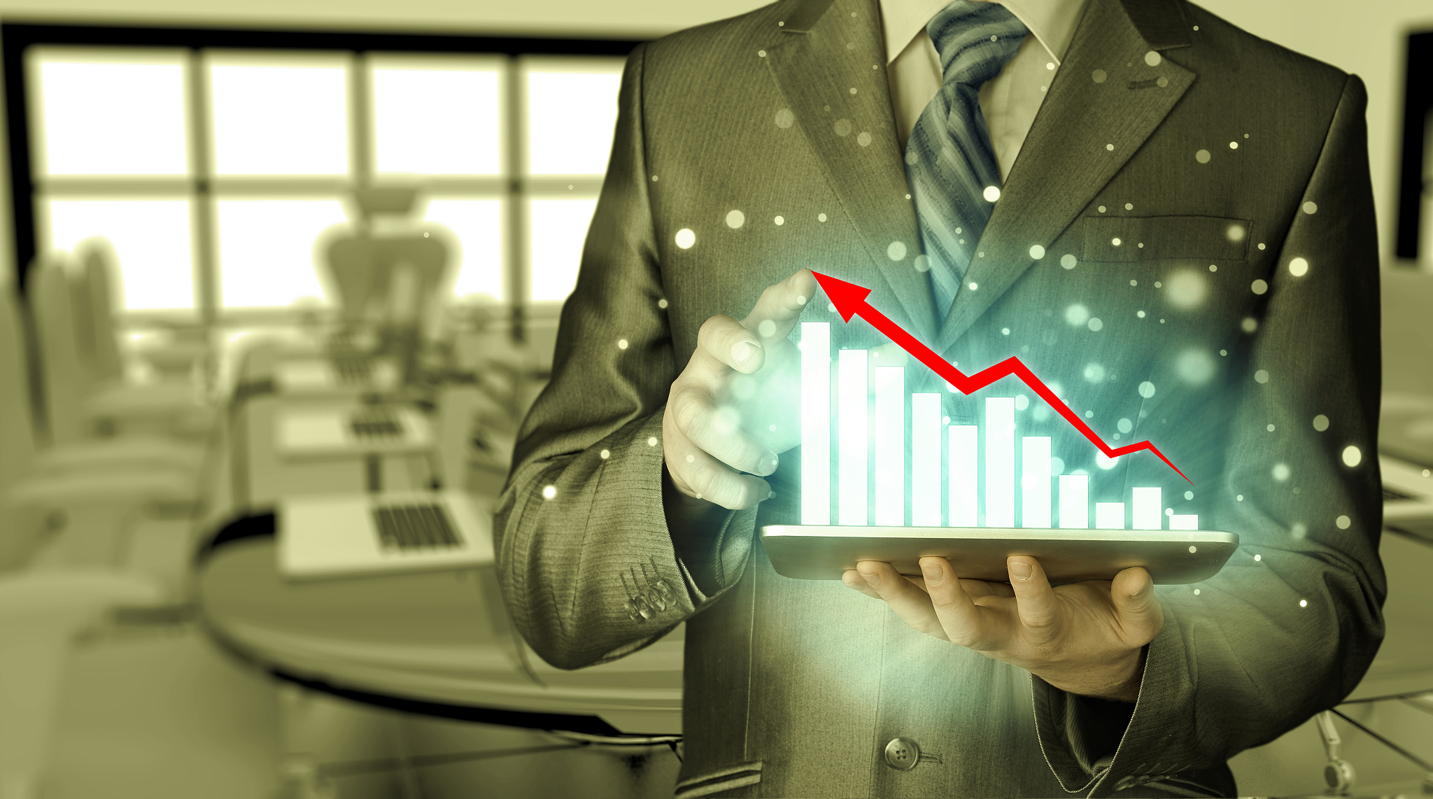 business man using tablet computer to work with financial data