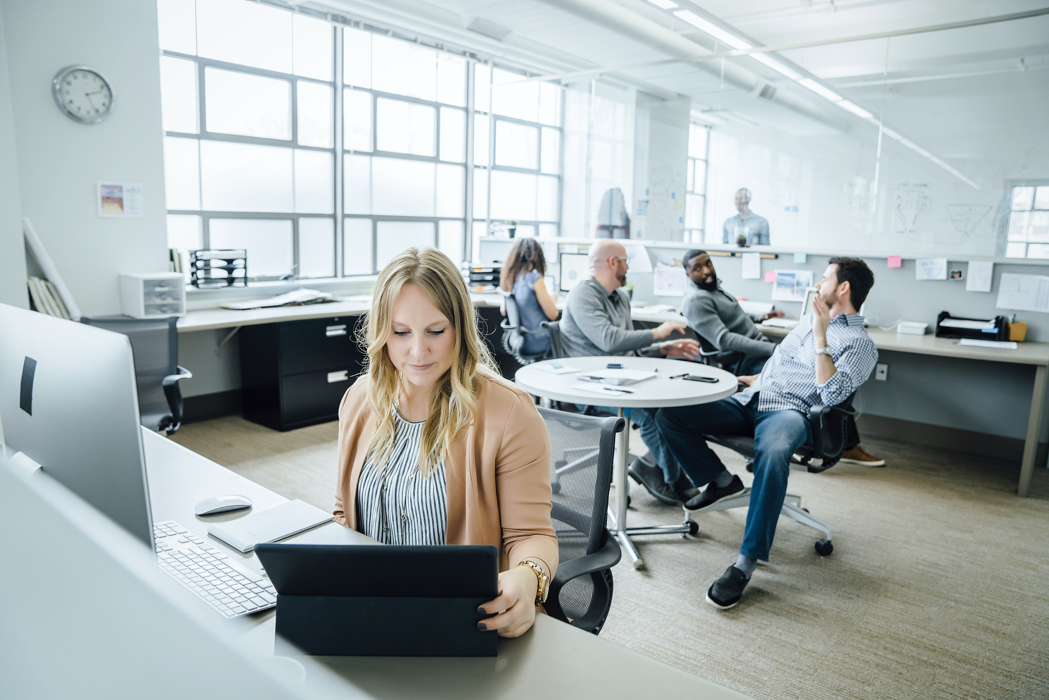 woman using digital tablet in office