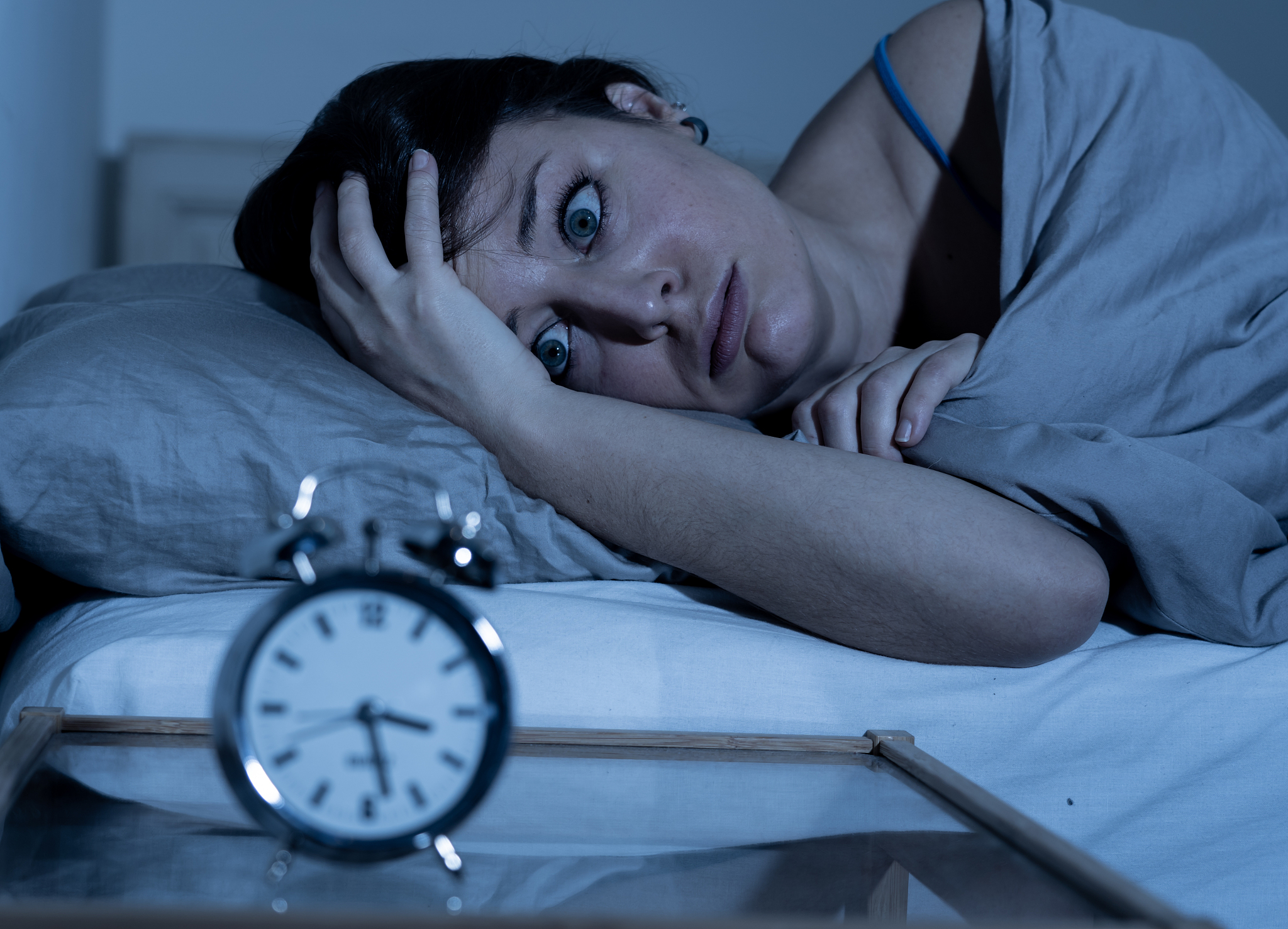 sleepless and desperate beautiful caucasian woman awake at night