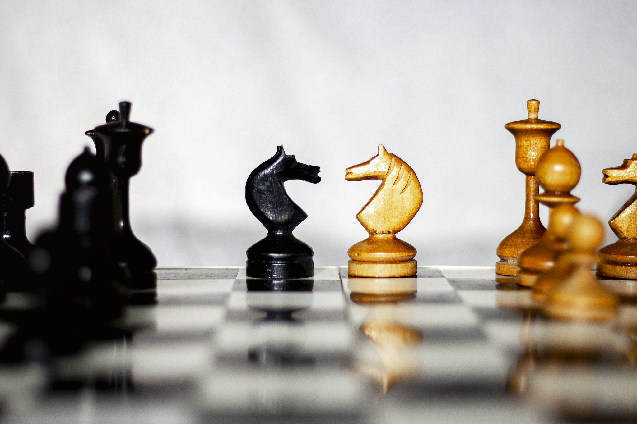beginning of the game. two chess teams in front of different col