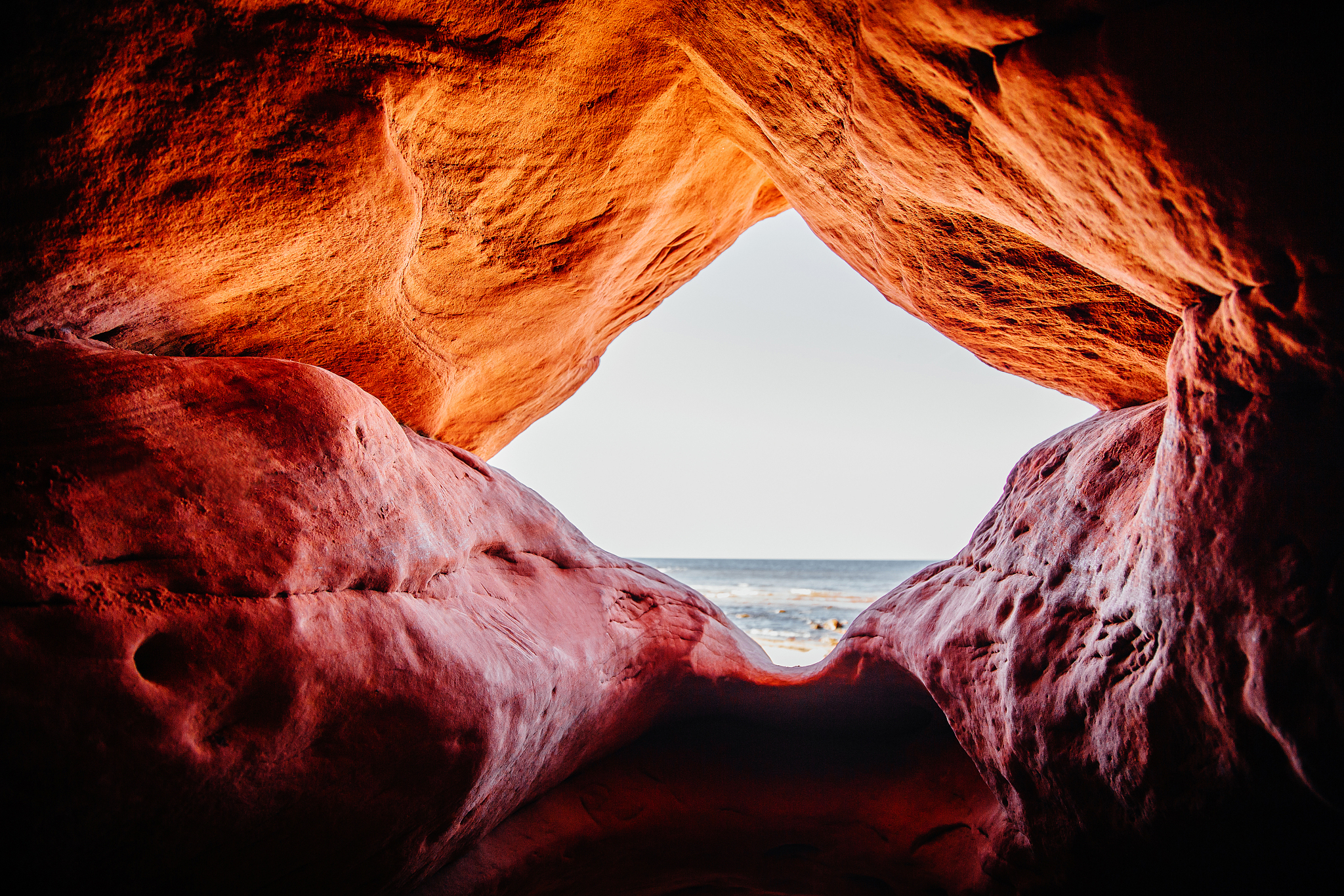 view from a cave to the sea.