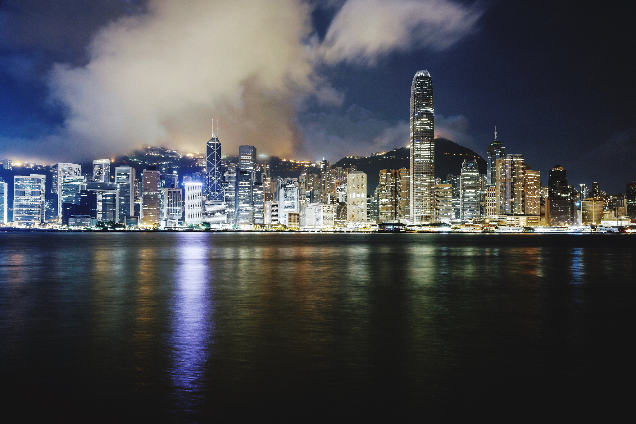 illuminated city at waterfront