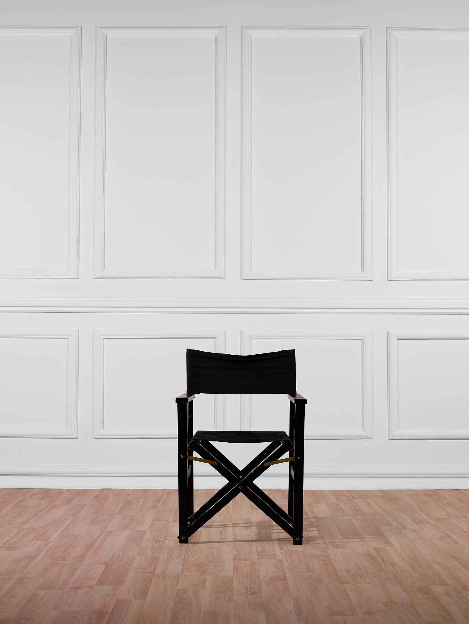 black director chair against wall