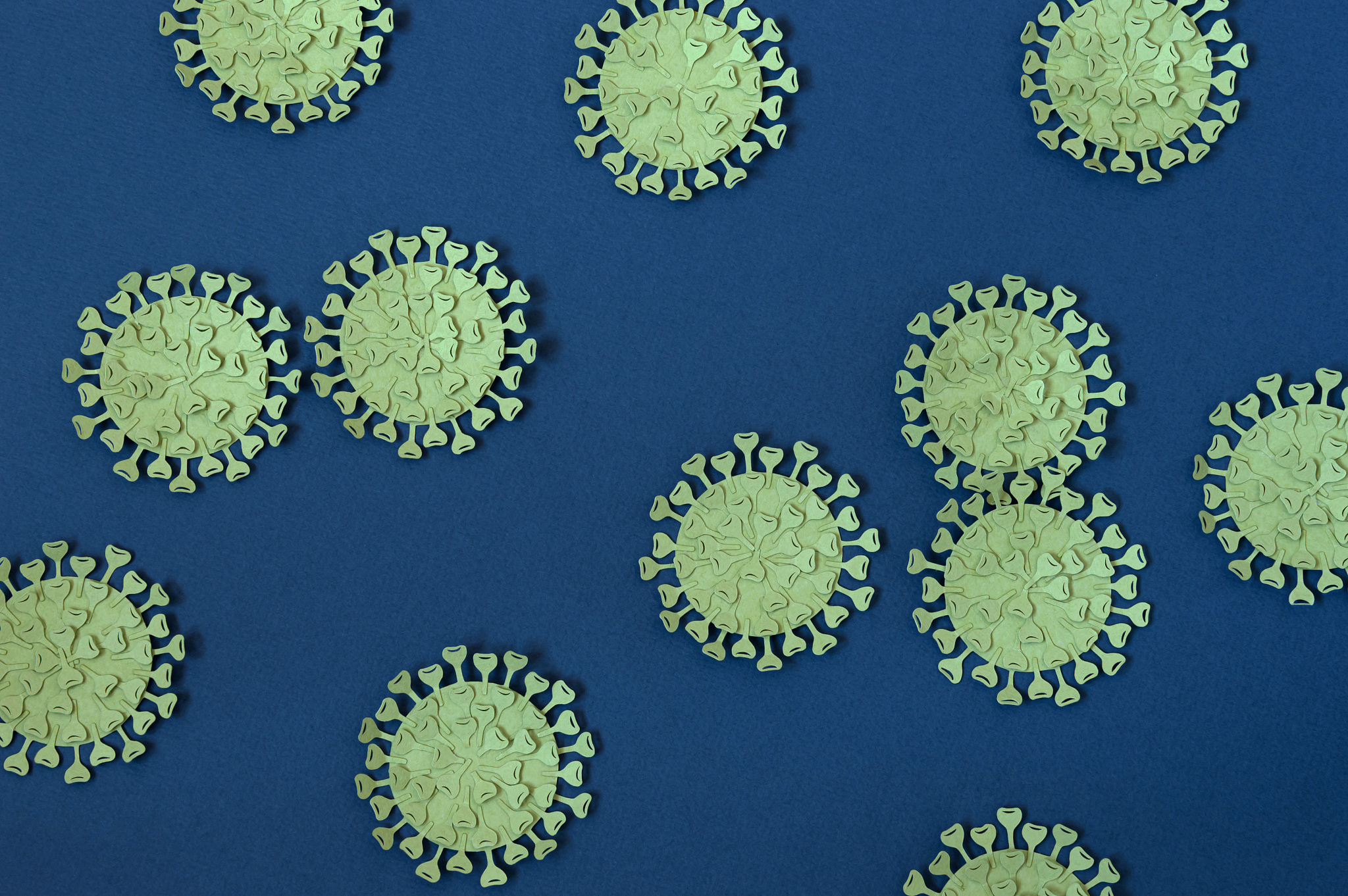pandemic covid-19. background with paper coronaviruses