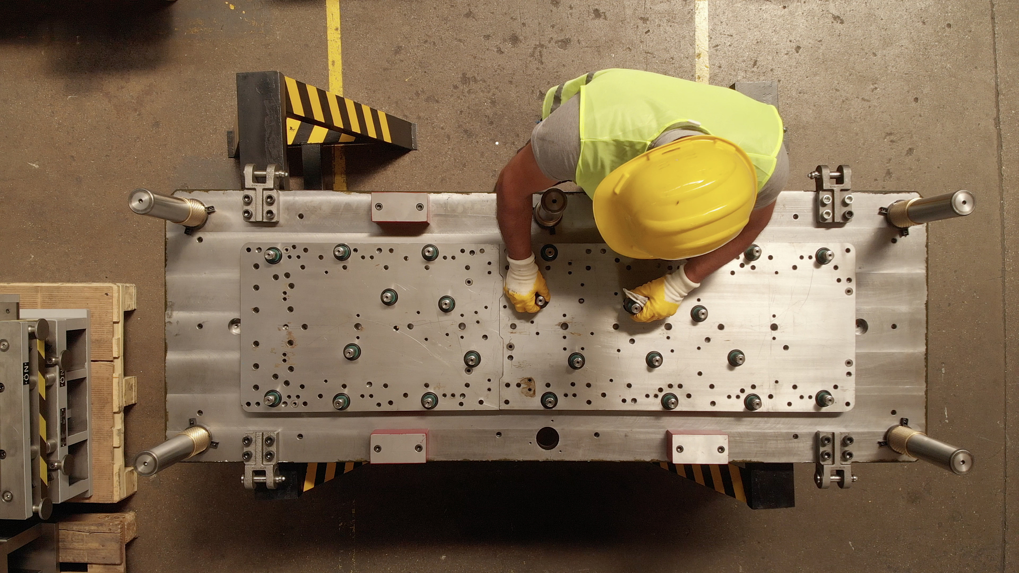 manuel worker in a production line of a machine part