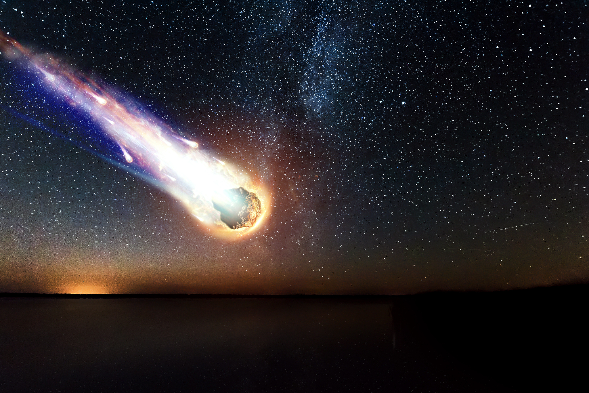 a comet, an asteroid, a meteorite falls to the ground against a 