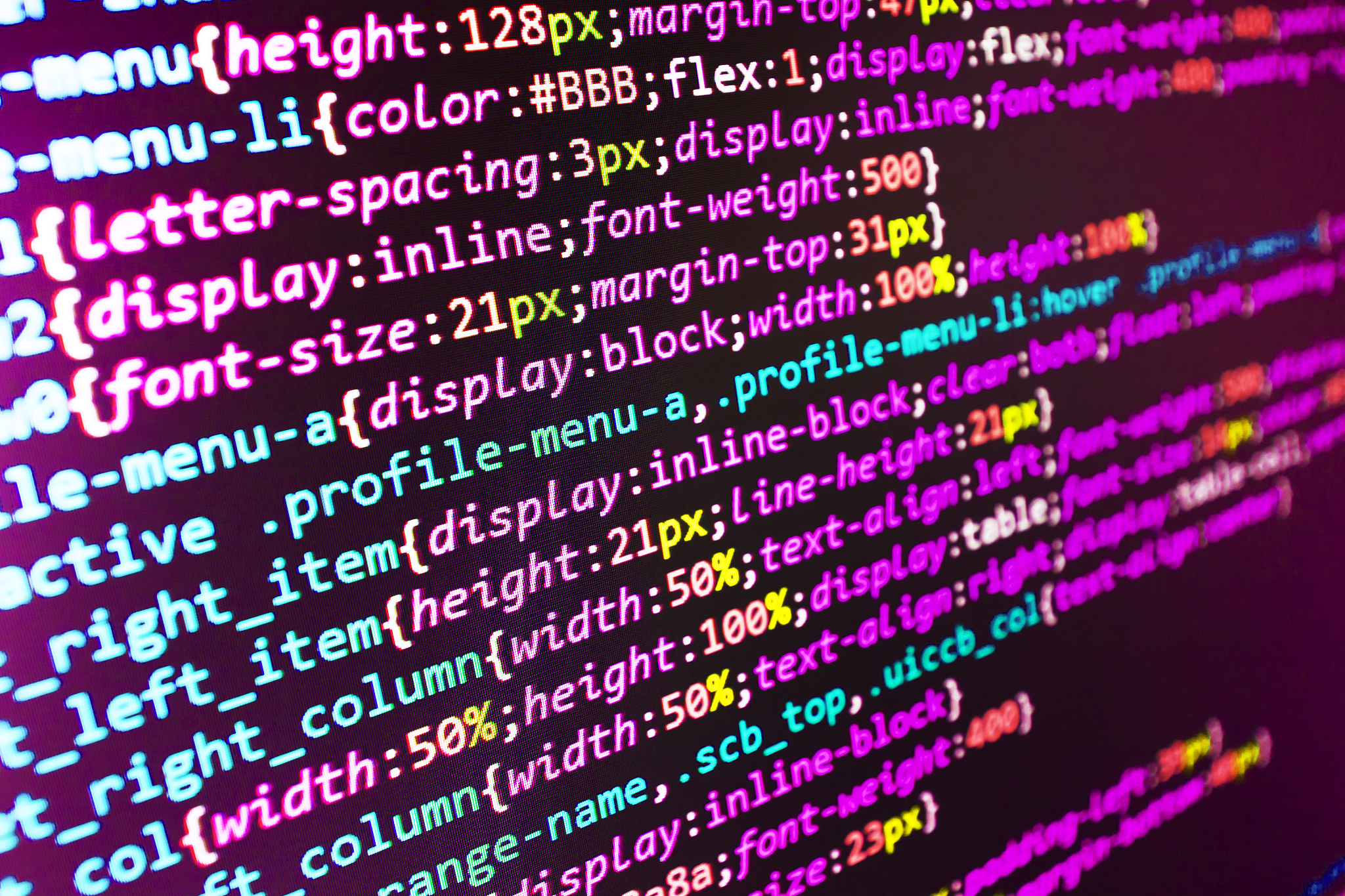 software developer programming code on computer