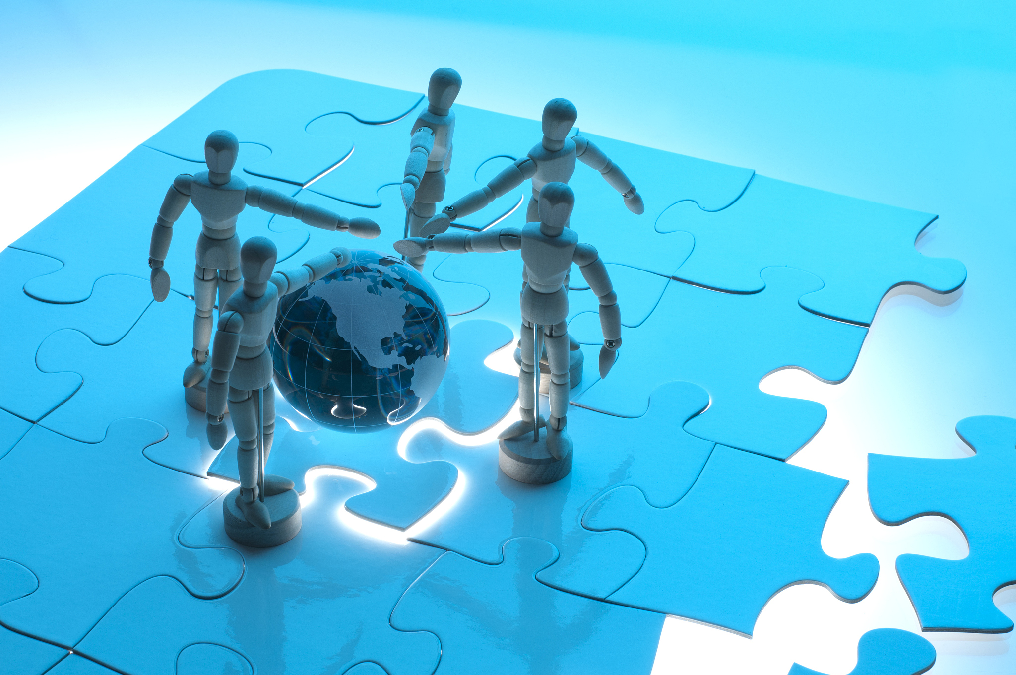 global teamwork concept with wooden figures