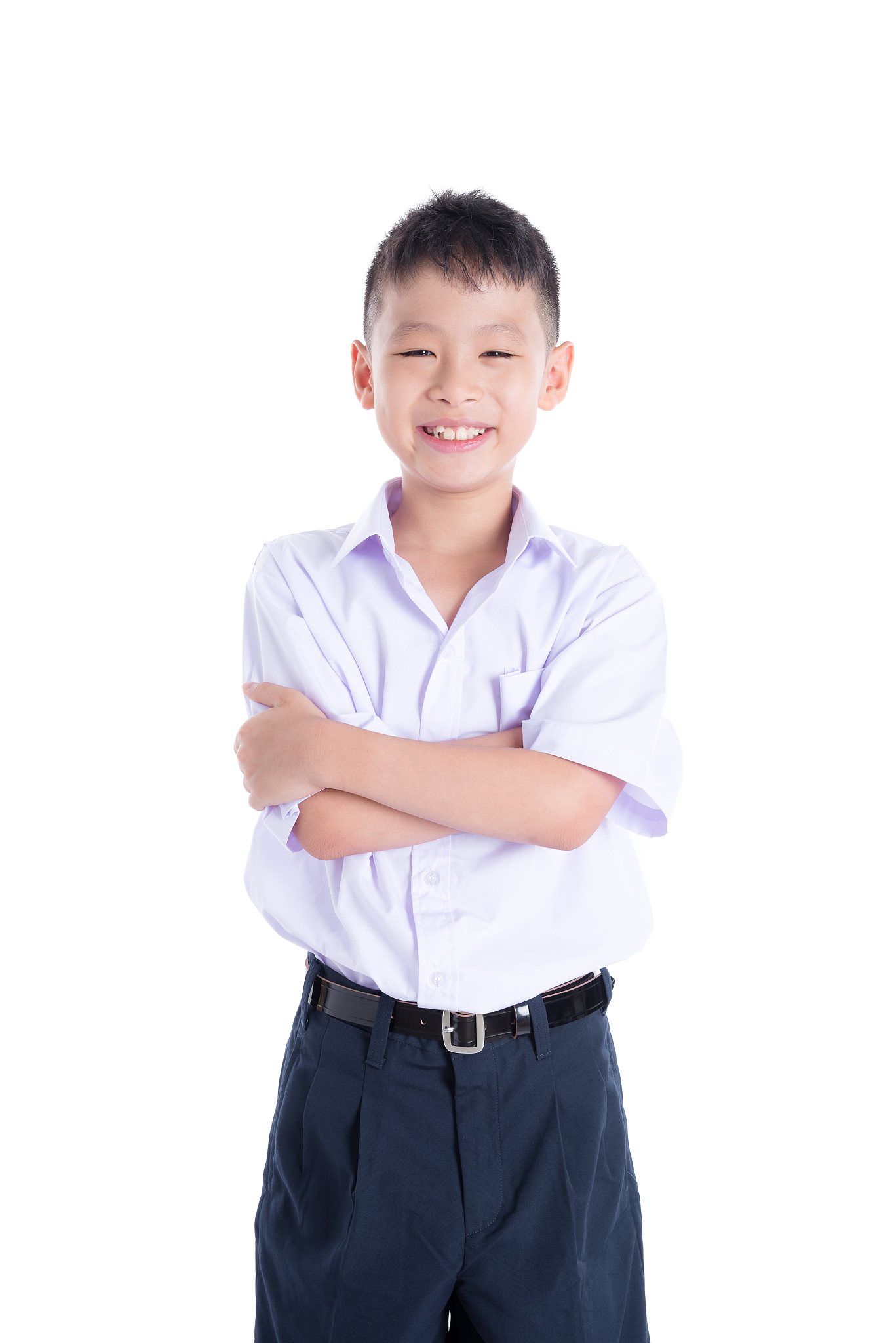 young student in uniform smiling over white