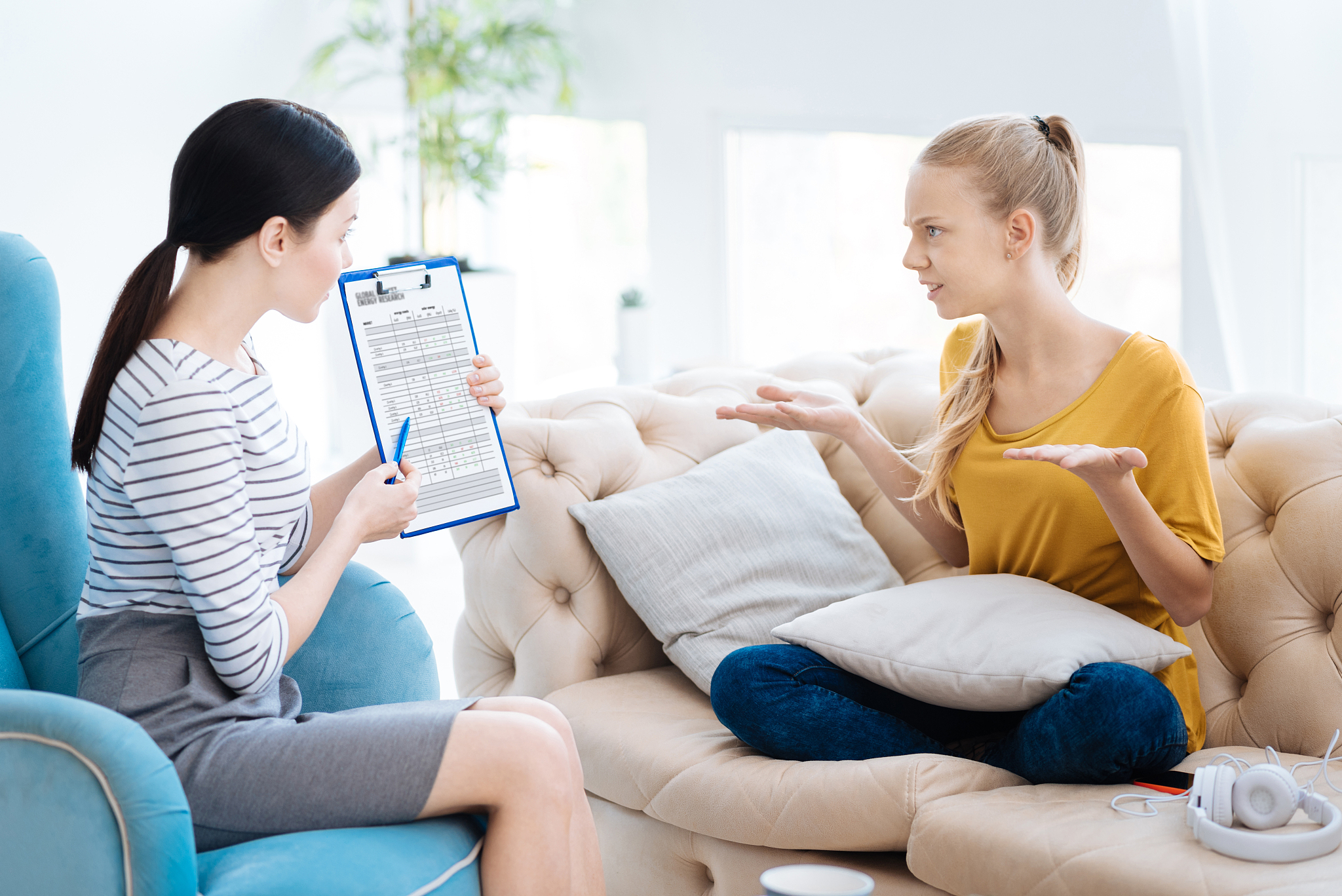 moody irritated woman talking to her therapist